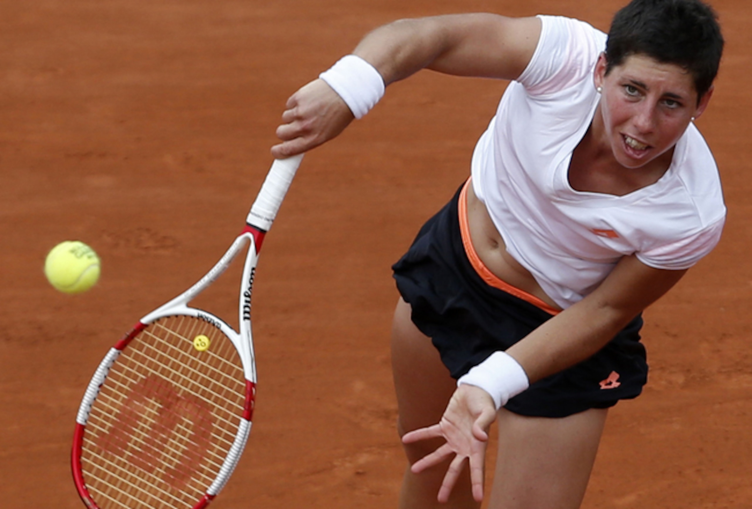 Carla Suarez Navarro serves during her quarterfinals match at the 2014 French Open. Carla Suarez Navarro serves during her quarterfinals match at the 2014 French Open.