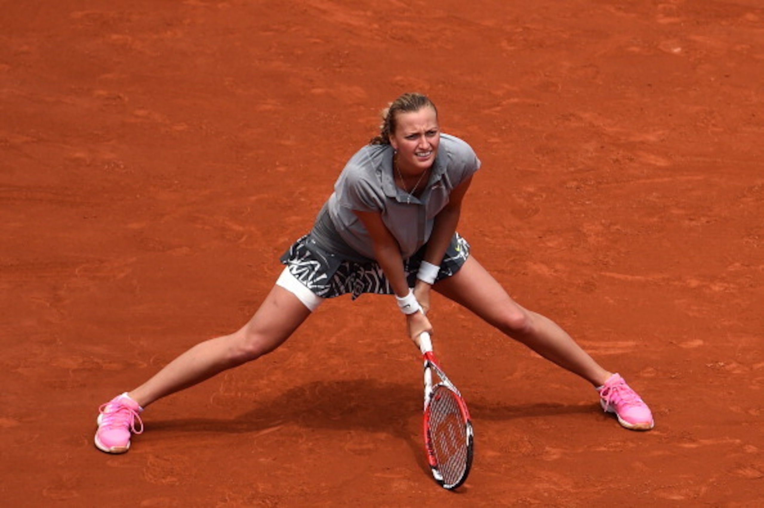 Petra Kvitova slides during her match against Svetlana Kuznetsova at the 2014 French Open. Petra Kvitova slides during her match against Svetlana Kuznetsova at the 2014 French Open.