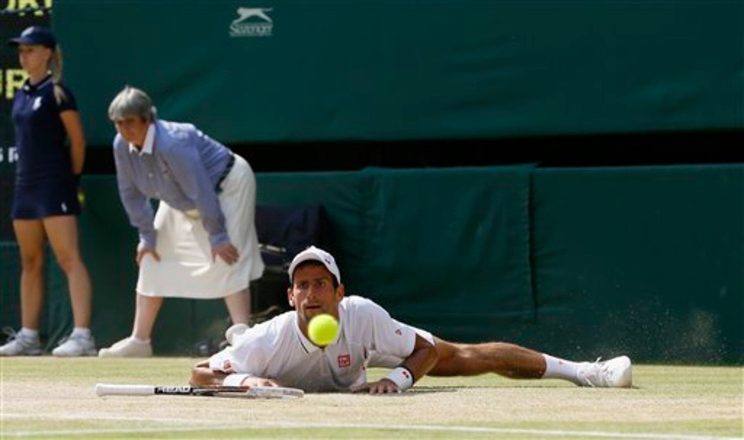 Novak Djokovic after he falls during a match at the 2013 Wimbledon Championships. Novak Djokovic after he falls during a match at the 2013 Wimbledon Championships.