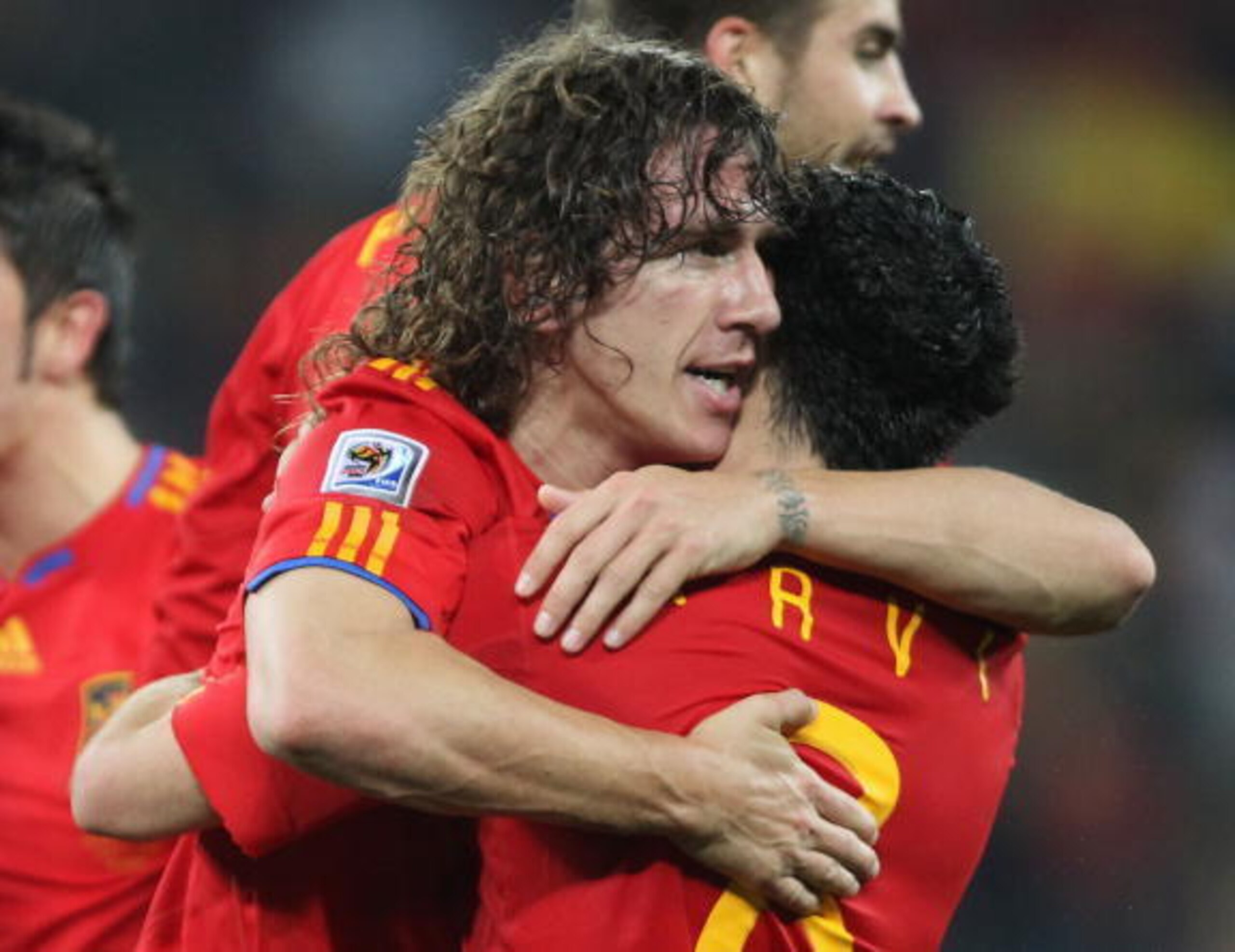 DURBAN, SOUTH AFRICA - JULY 07:  Carles Puyol of Spain celebrates scoring the opening goal with team mate Xavi Hernandez during the 2010 FIFA World Cup South Africa Semi Final match between Germany and Spain at Durban Stadium on July 7, 2010 in Durban, So