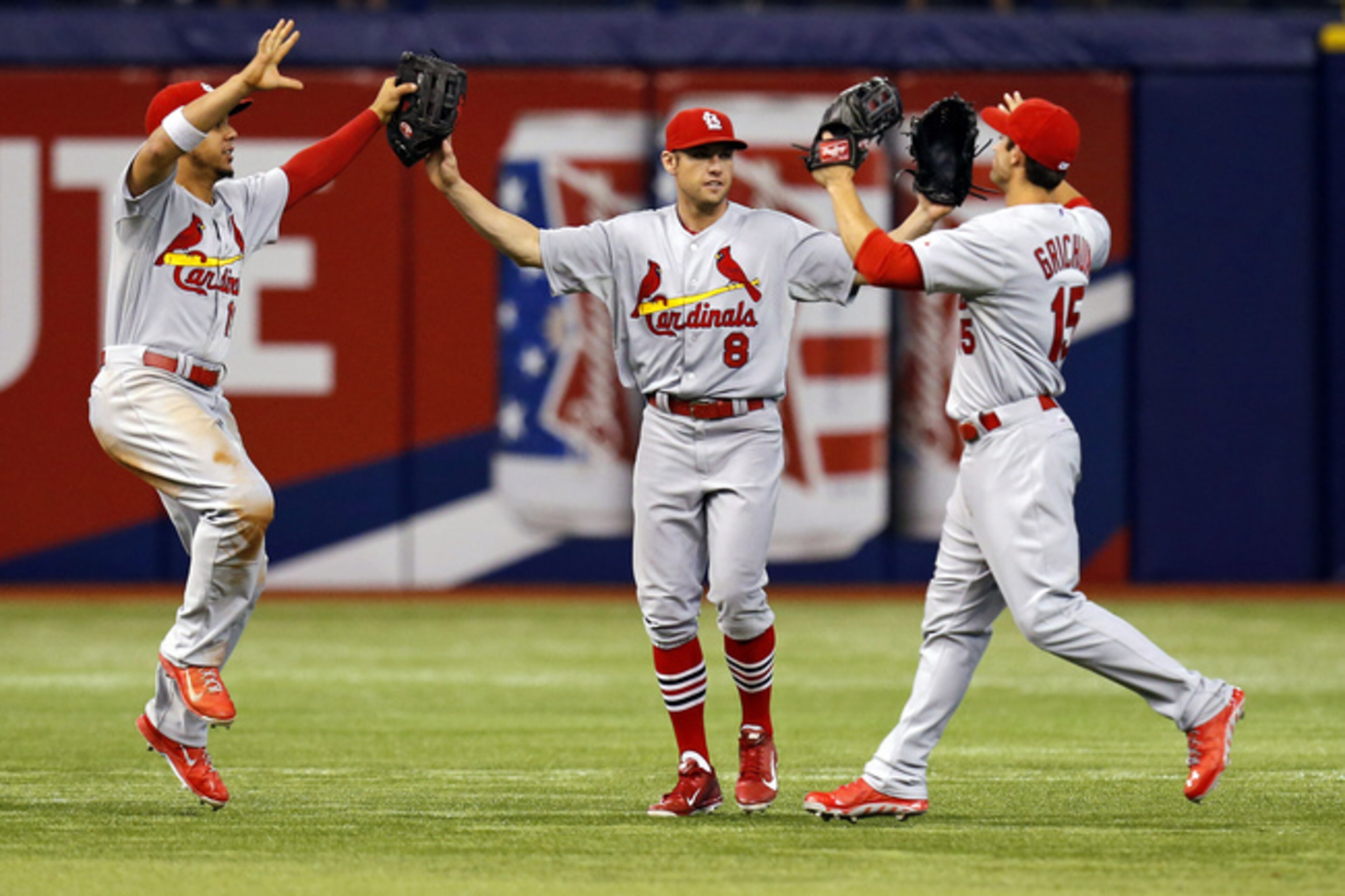 Jon Jay (left), Peter Bourjos (middle) and Randal Grichuk (right) celebrate after defeating Tampa Bay 1-0 on June 10.