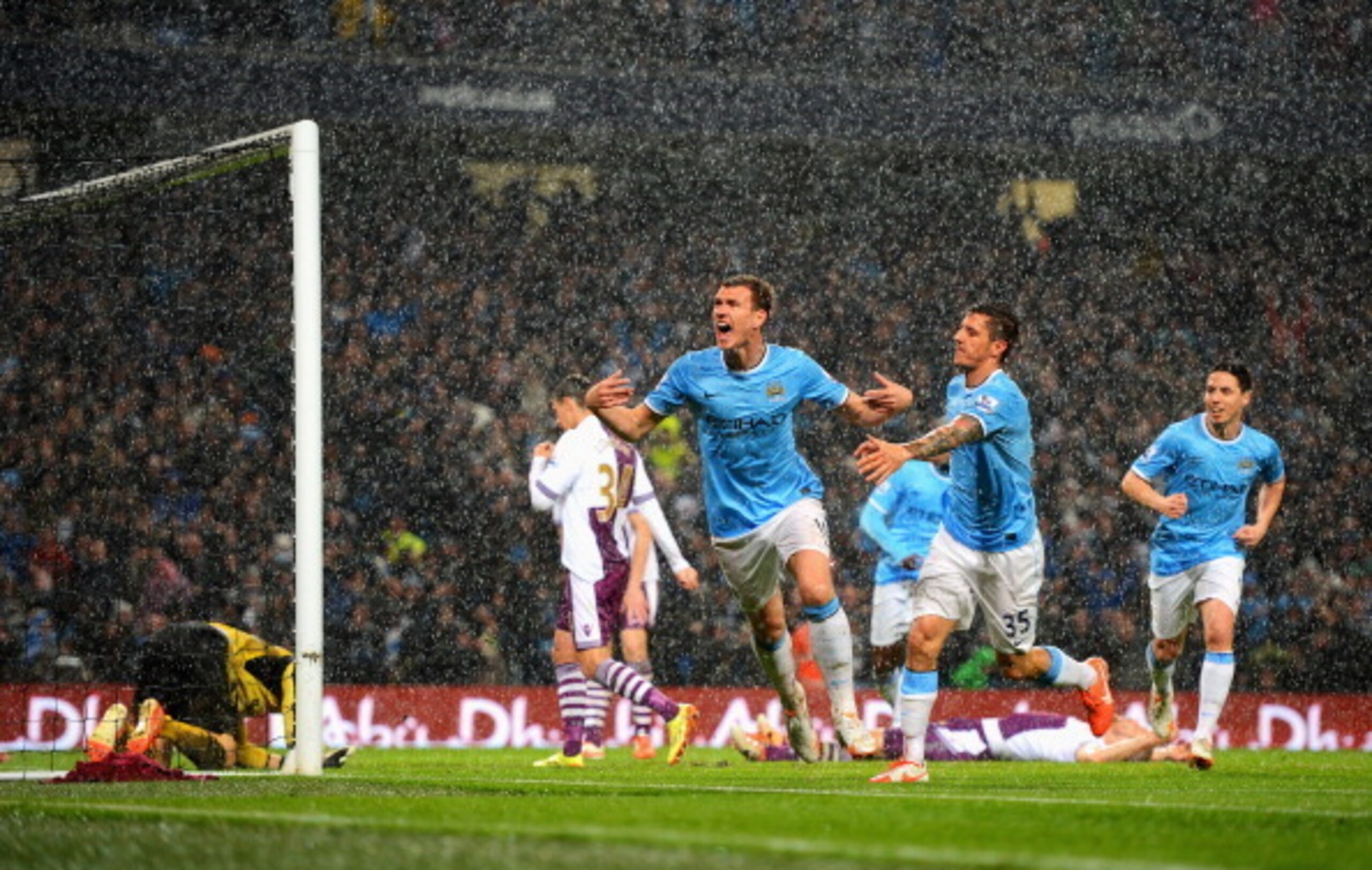 MANCHESTER, ENGLAND - MAY 07:  Edin Dzeko of Manchester City celebrates scoring the opening goal during the Barclays Premier League match between Manchester City and Aston Villa at Etihad Stadium on May 7, 2014 in Manchester, England.  (Photo by Michael R