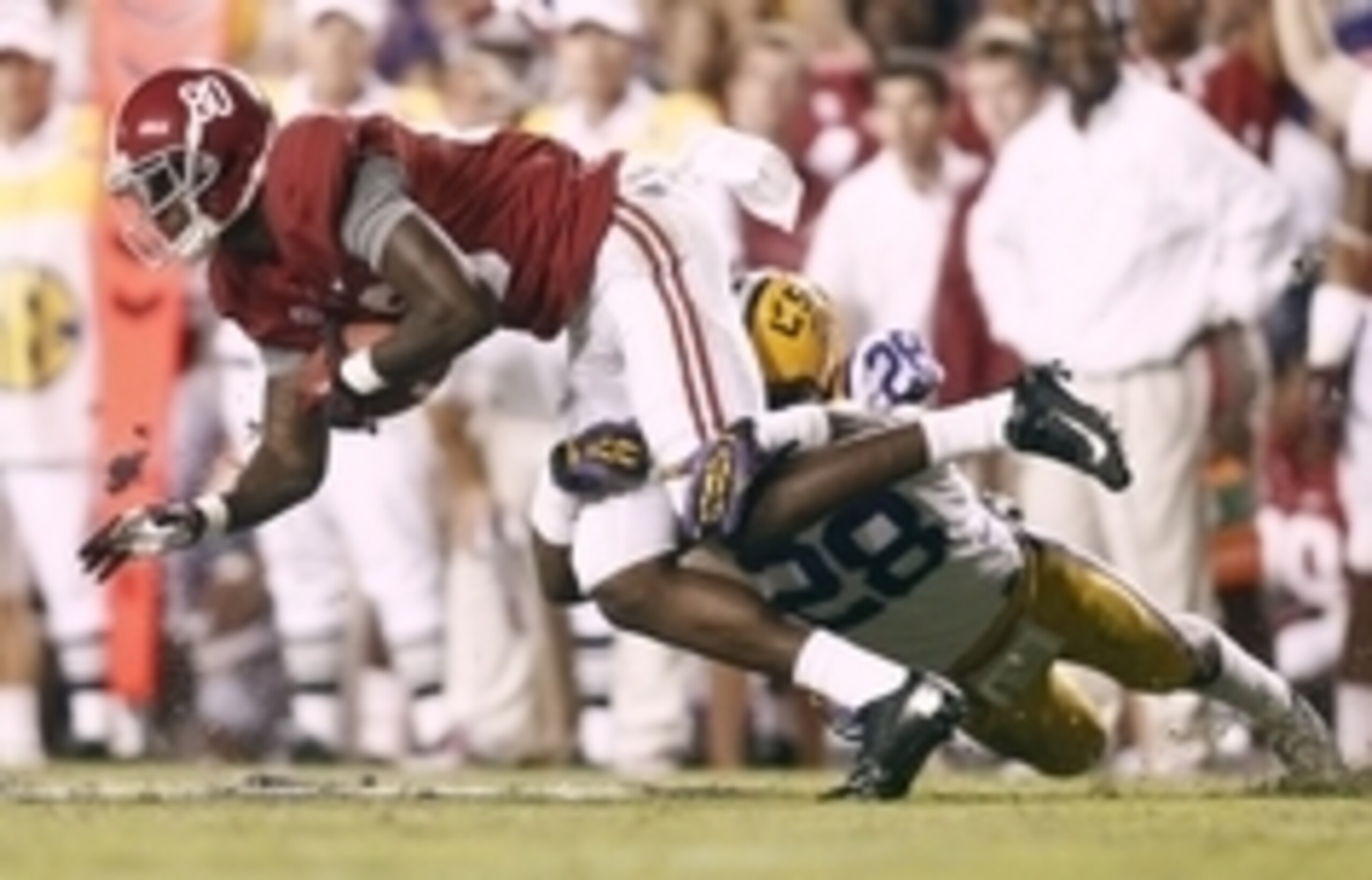 November 3, 2012; Baton Rouge, LA, USA; Alabama Crimson Tide wide receiver Marvin Shinn (80) is tackled by LSU Tigers cornerback Jalen Mills (28) during the fourth quarter at Tiger Stadium. Alabama defeated LSU, 21-17. Mandatory Credit: Crystal LoGiudice-