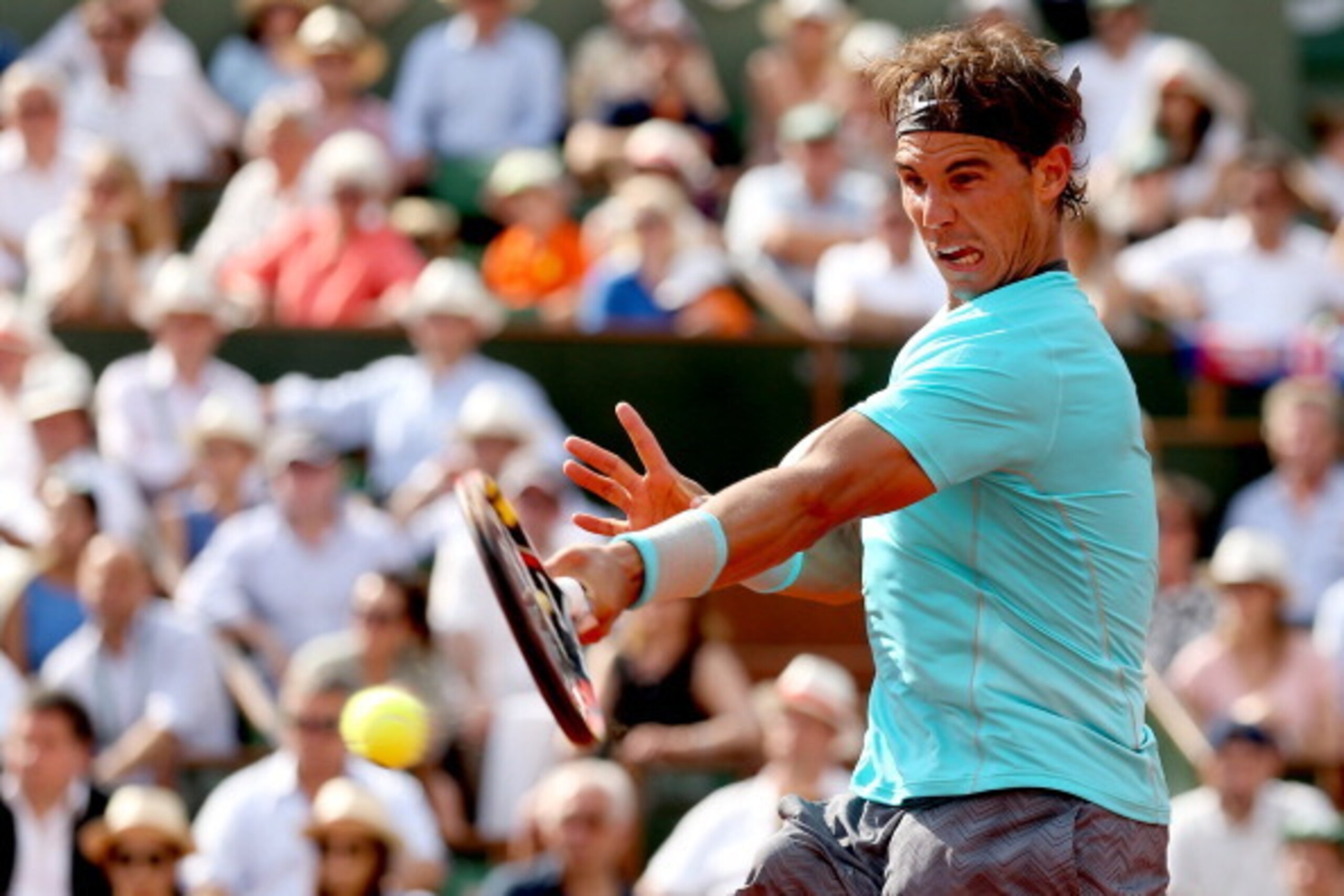 PARIS, FRANCE - JUNE 08:  Rafael Nadal of Spain returns a shot during his men's singles final match against Novak Djokovic of Serbia on day fifteen of the French Open at Roland Garros on June 8, 2014 in Paris, France.  (Photo by Matthew Stockman/Getty Ima