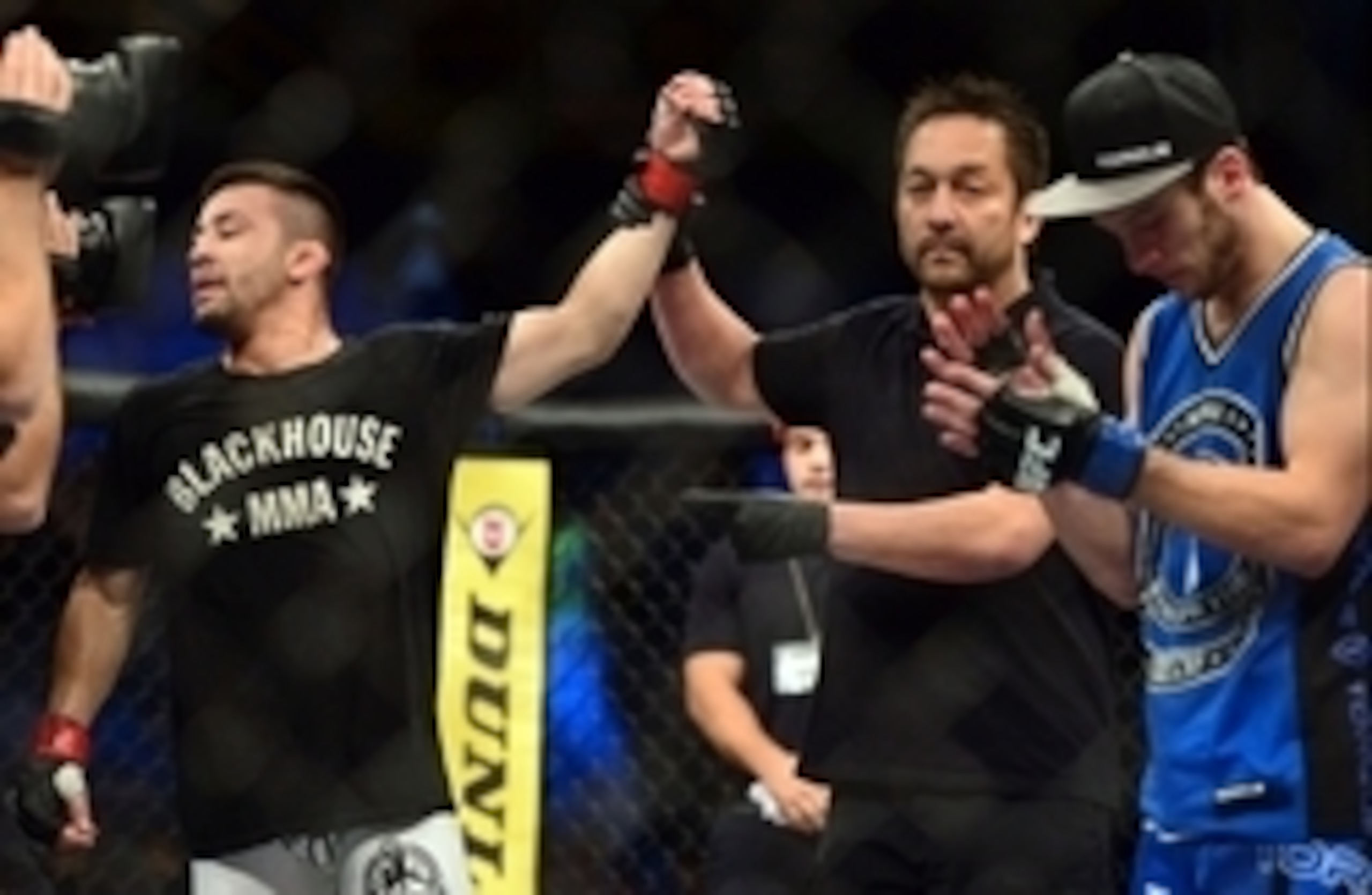 May 31, 2014; Sao Paulo, SP, BRAZIL;  Pedro Munhoz (red gloves) defeats Matt Hobar (blue gloves) during the TUF Brazil 3 Finale at Ibirapuera  Gymnasium. Mandatory Credit: Jason Silva-USA TODAY Sports
