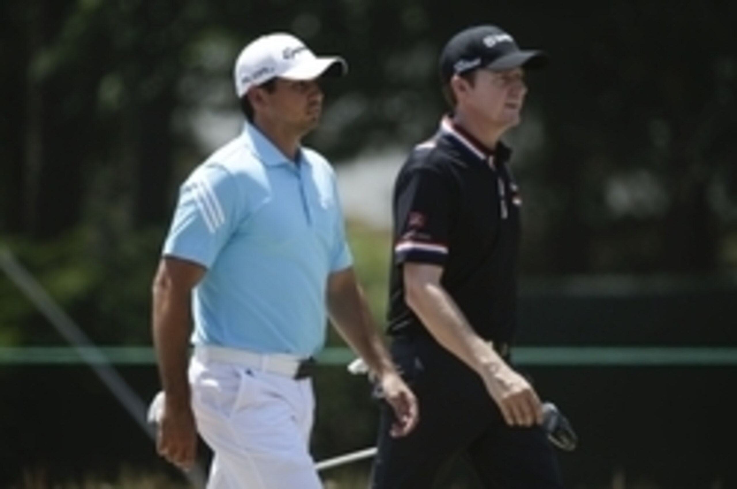 Jimmy Walker (right) walks with Jason Day on Sunday.