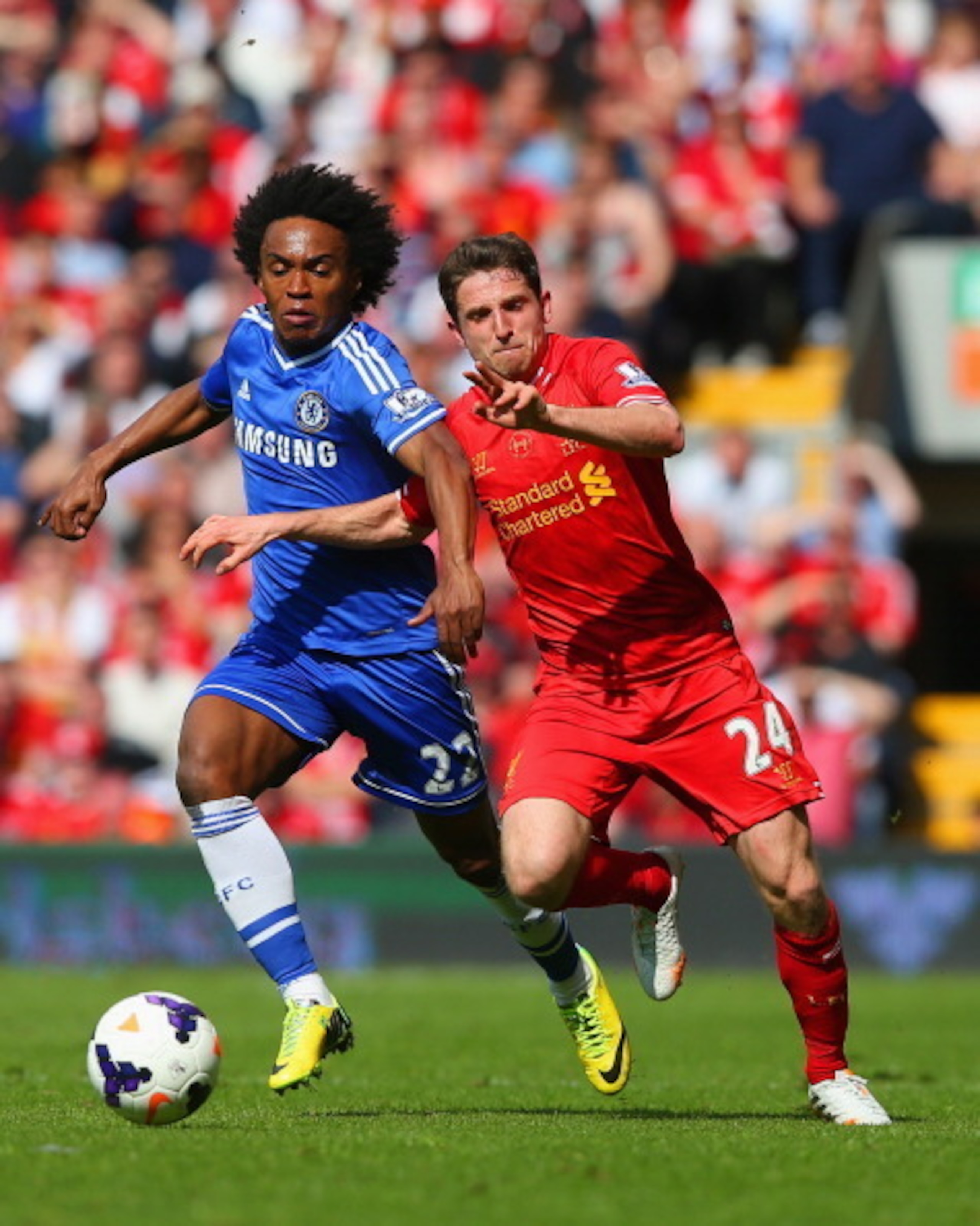 Willian battles Liverpool's Joe Allen during April's title-deciding match at Anfield.