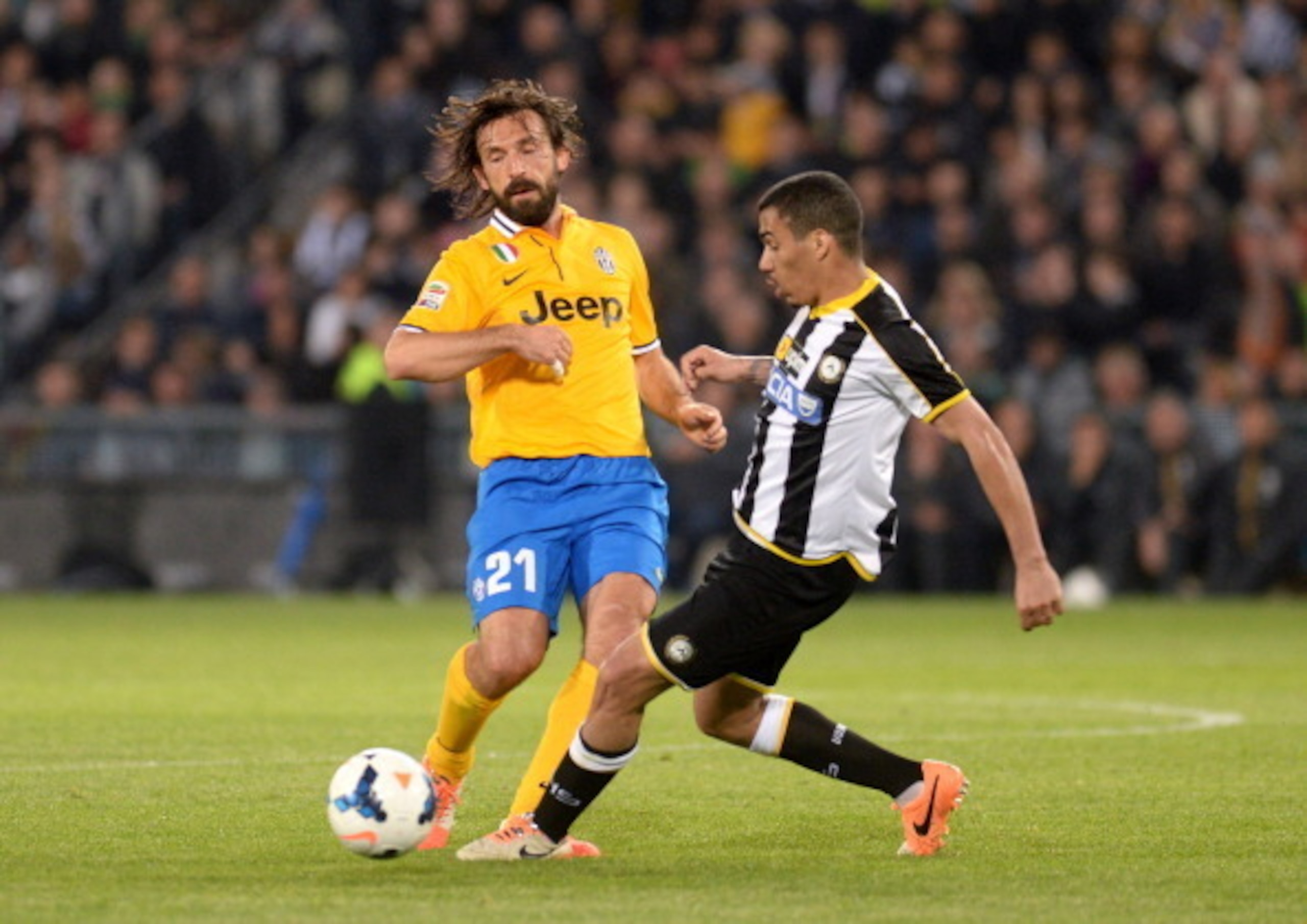 Allan (right) duels with Andrea Pirlo for a ball in the teams' April duel at the Friuli.