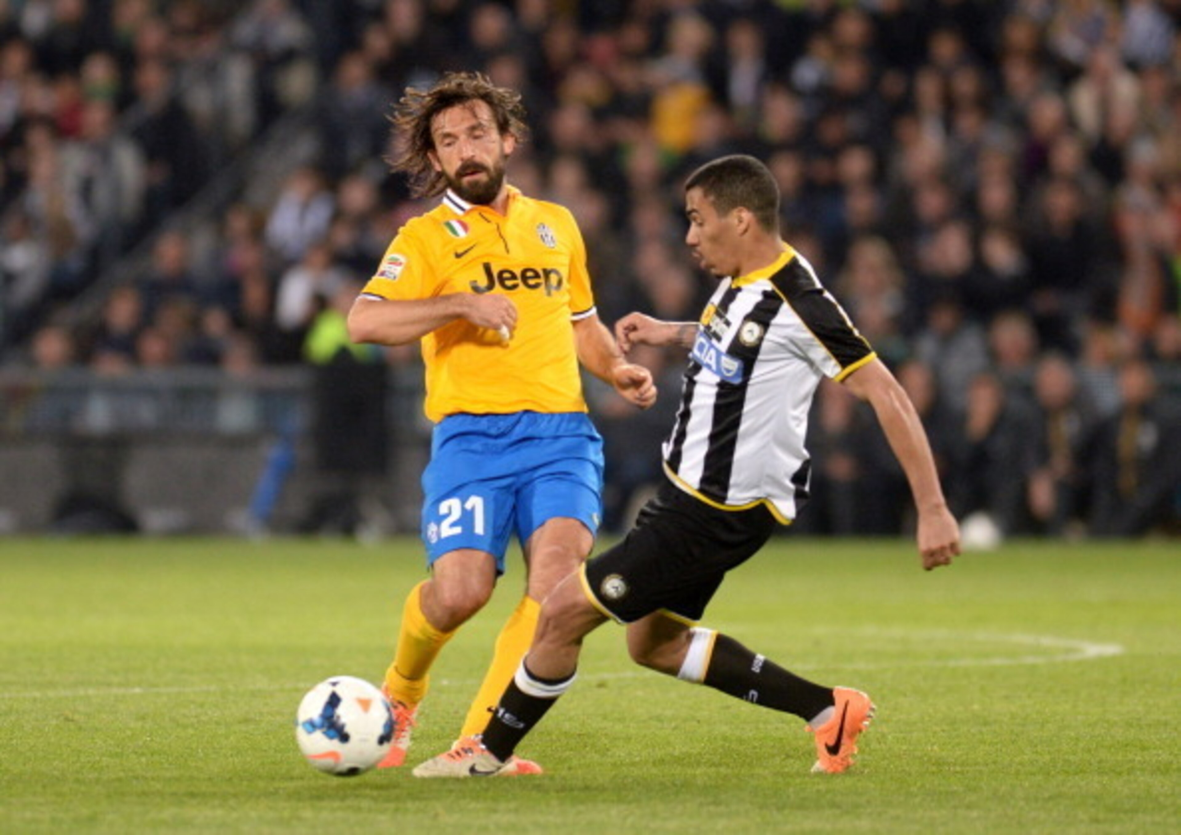 Allan (right) duels with Andrea Pirlo for a ball in the teams' April duel at the Friuli.