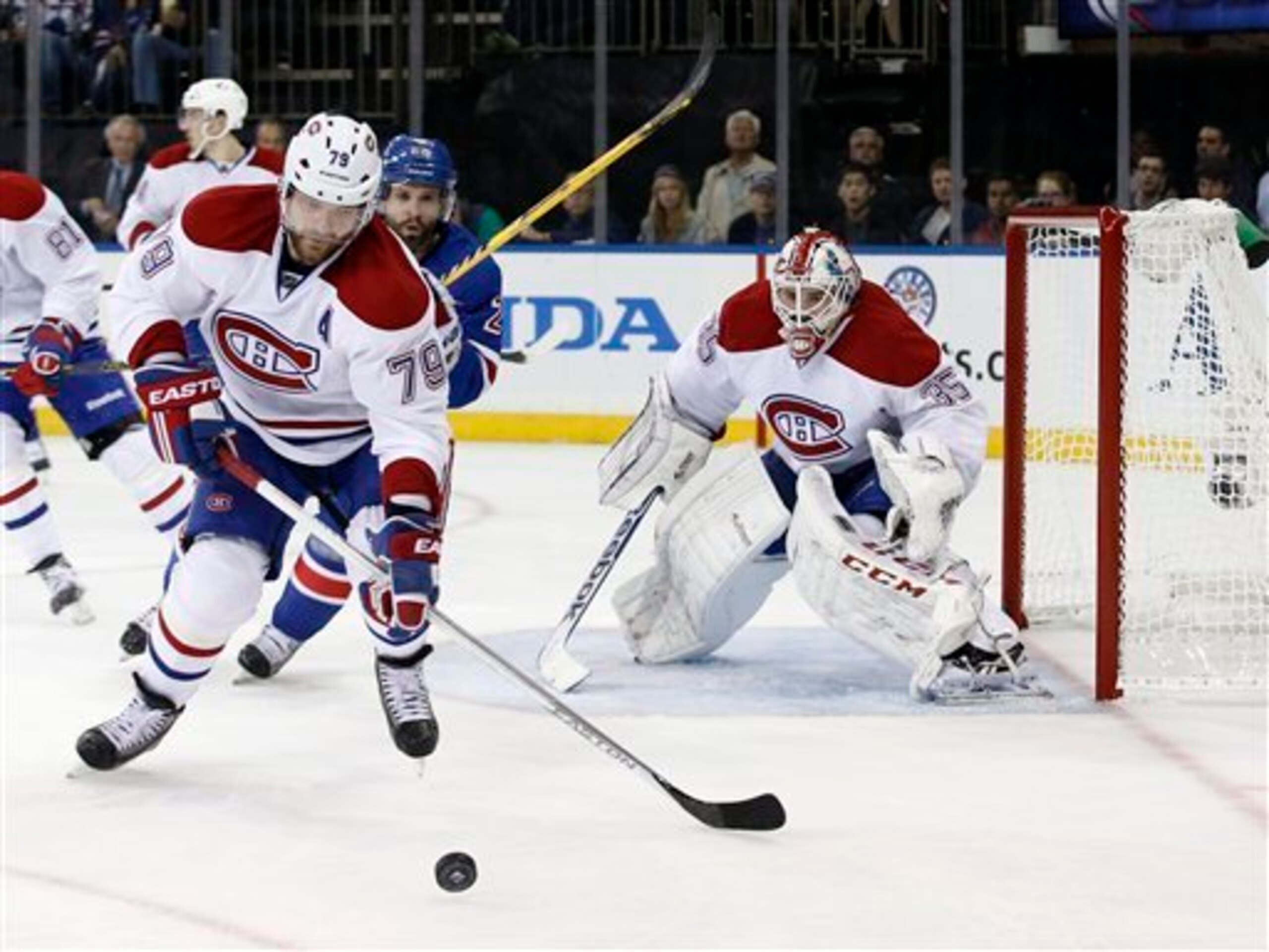 Montreal Canadiens defenseman Andrei Markov, New York Rangers forward Martin St. Louis and Habs goaltender Dustin Tokarski.