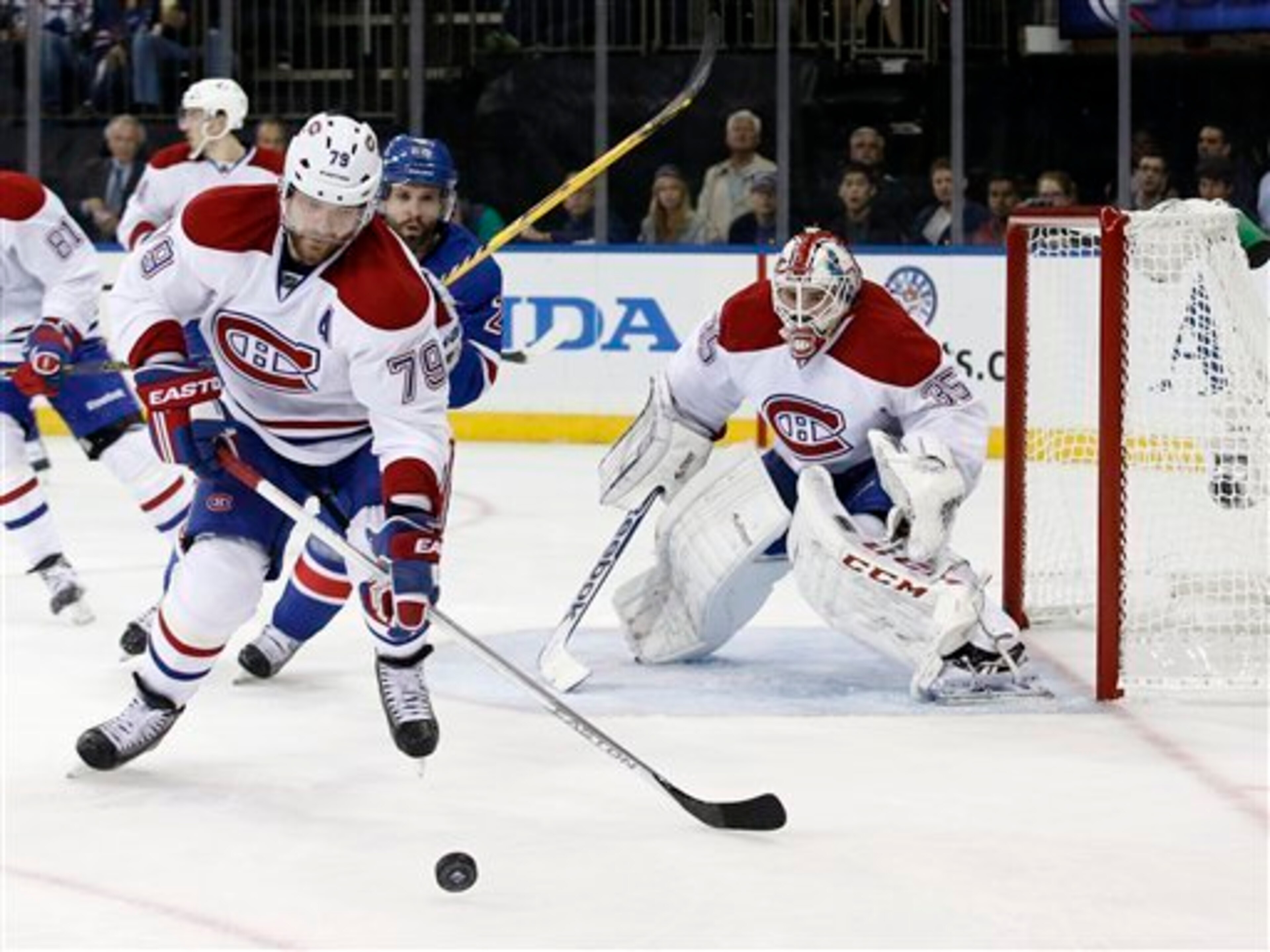 Montreal Canadiens defenseman Andrei Markov, New York Rangers forward Martin St. Louis and Habs goaltender Dustin Tokarski.