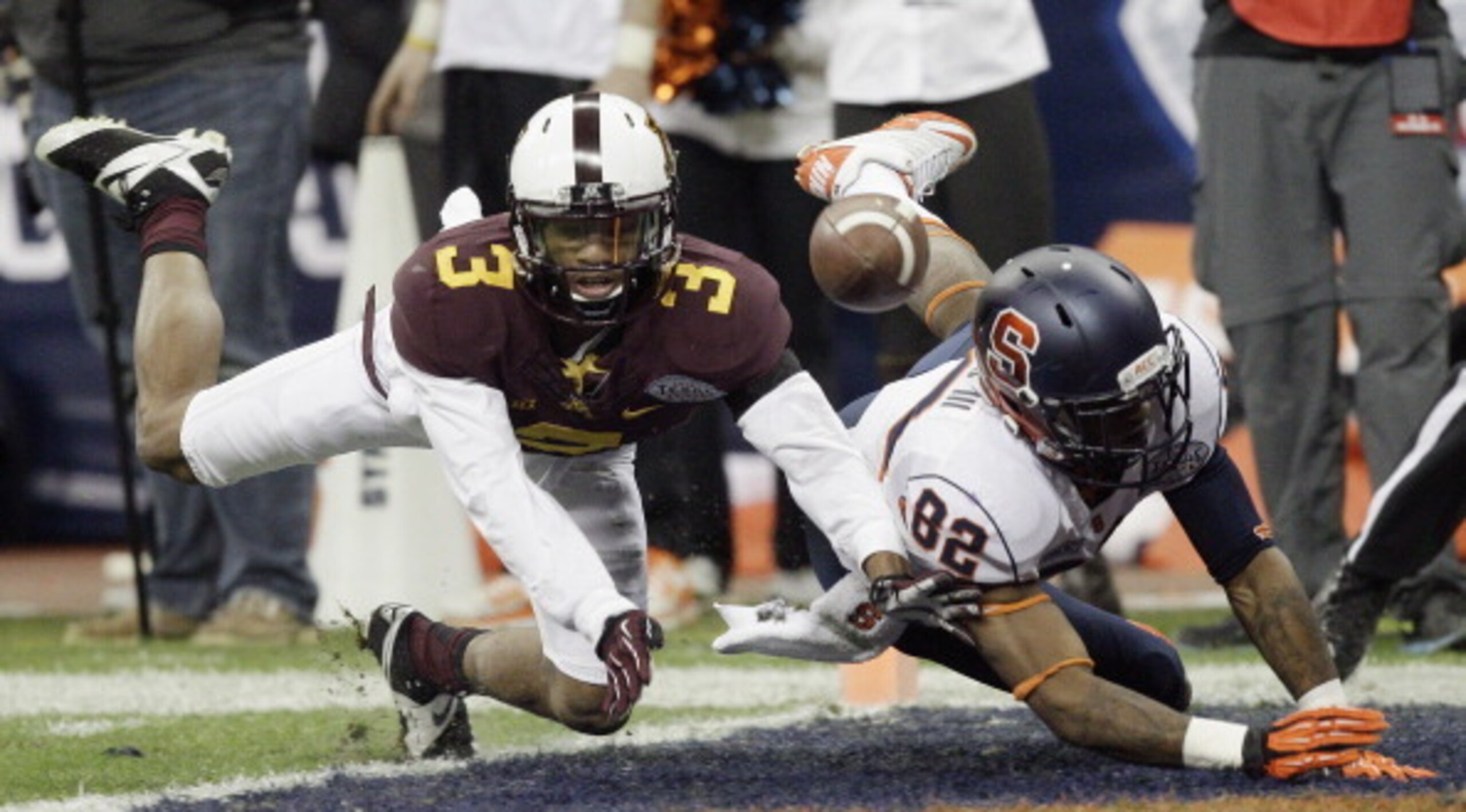 HOUSTON, TX - DECEMBER 27:  Martez Shabazz #3 of the Minnesota Golden Gophers breaks up a pass intended for Alvin Cornelius #82 of the Syracuse Orange at Reliant Stadium on December 27, 2013 in Houston, Texas.  (Photo by Bob Levey/Getty Images)