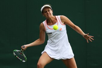 Jana Cepelova focuses on the ball during her first-round match at Wimbledon, 2014.