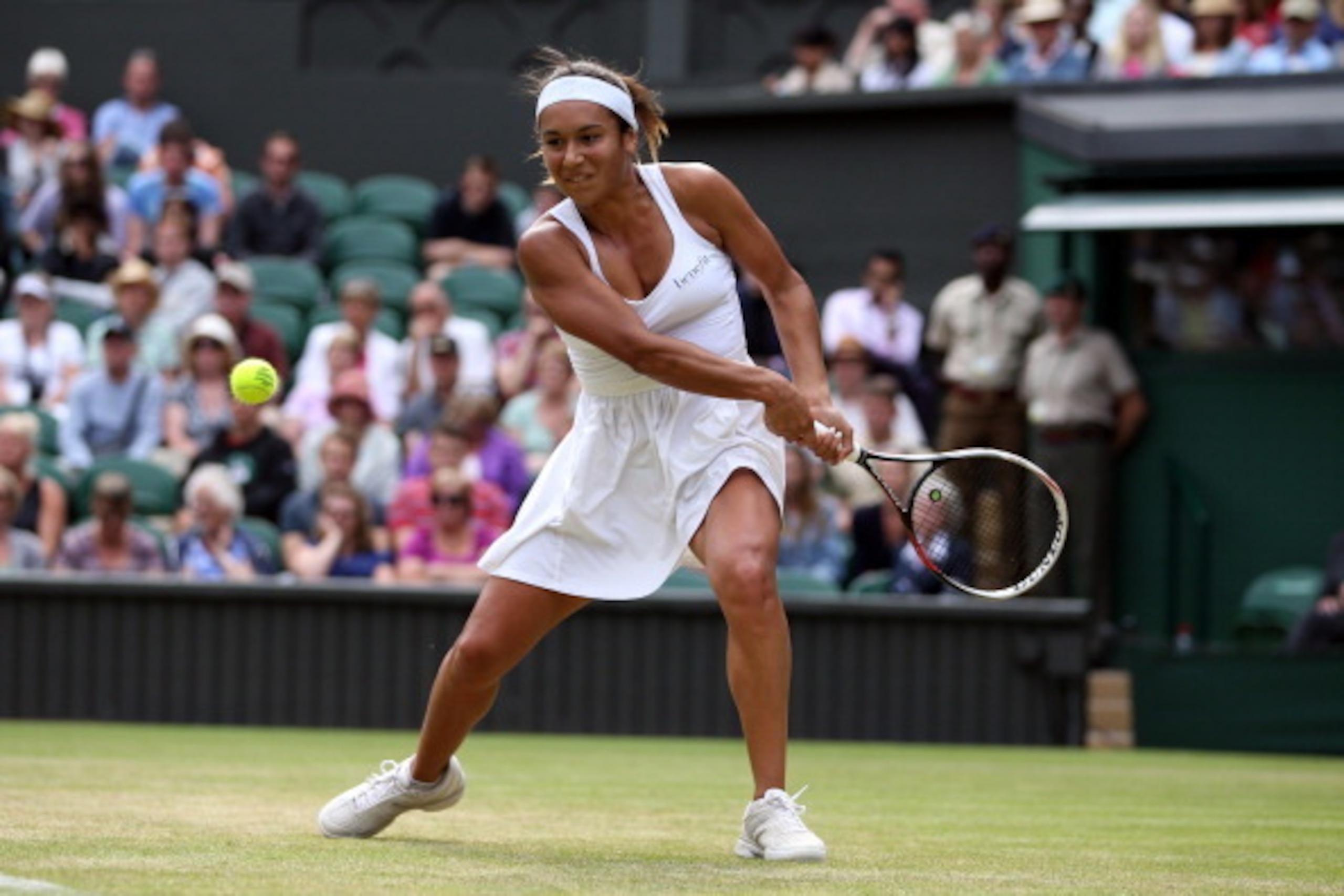 Heather Watson goes for a backhand during her second-round match at Wimbledon.
