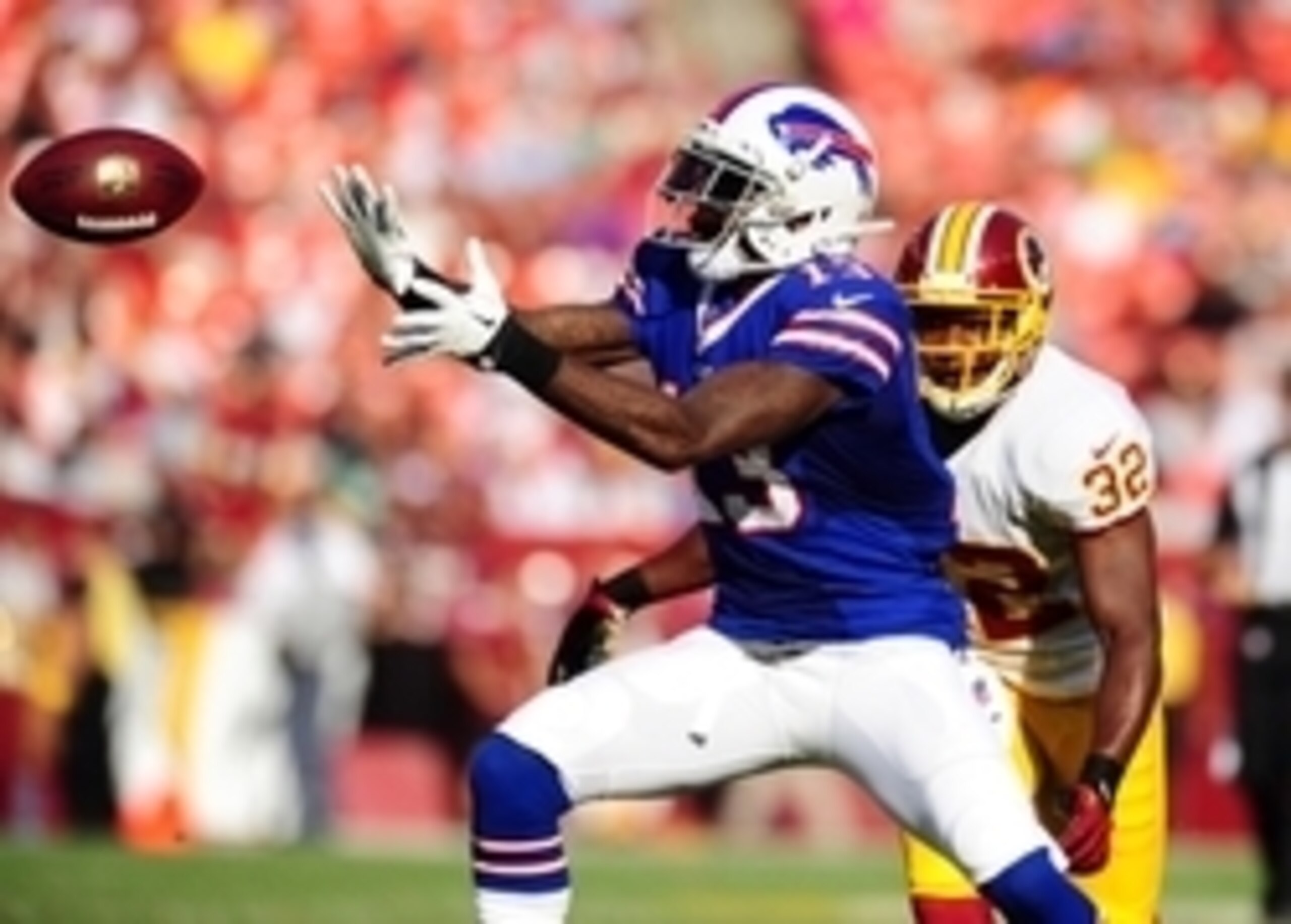 Aug 24, 2013; Landover, MD, USA; Buffalo Bills wide receiver Stevie Johnson (13) catches a pass in front of Washington Redskins safety Jordan Pugh (32) at FedEx Field. Mandatory Credit: Evan Habeeb-USA TODAY Sports