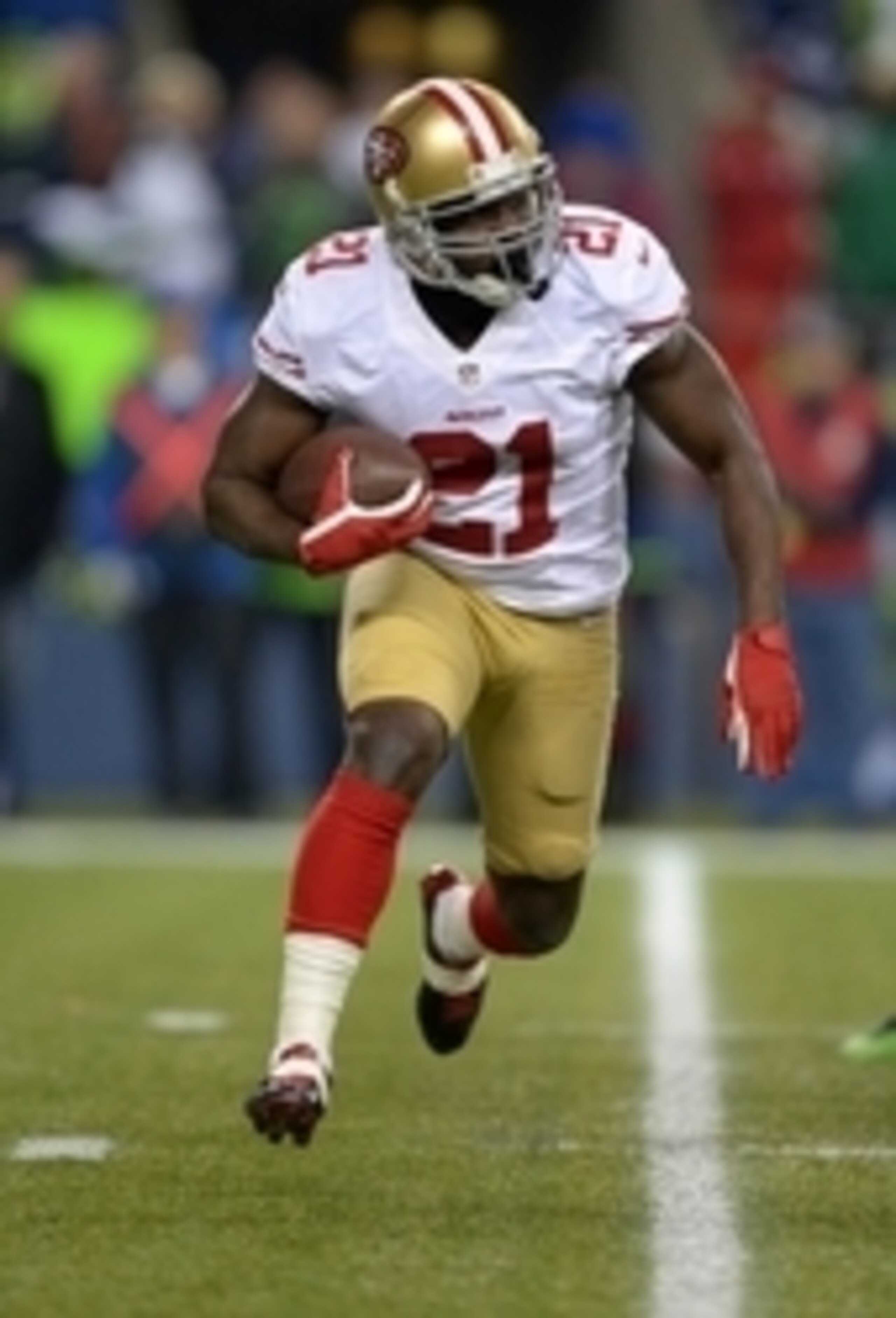 Jan 19, 2014; Seattle, WA, USA; San Francisco 49ers running back Frank Gore (21) carries the ball during the third quarter of the 2013 NFC Championship football game against the Seattle Seahawks at CenturyLink Field. Mandatory Credit: Kirby Lee-USA TODAY 