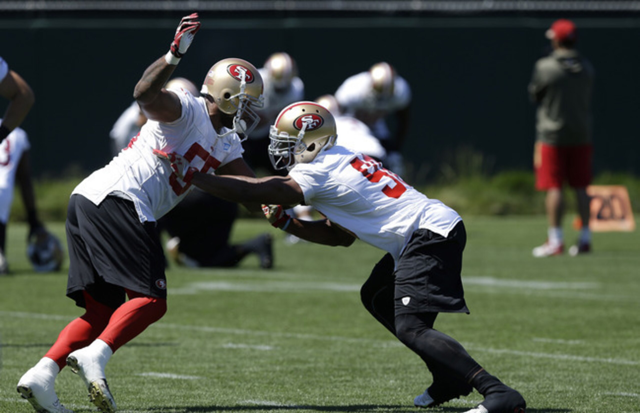 Outside linebacker Corey Lemonier (right) practices his technique during a team drill in this month's minicamp.