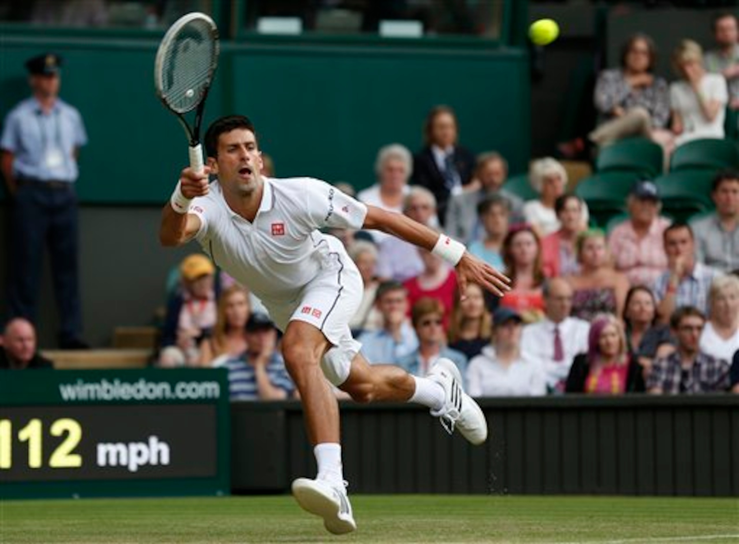 Novak Djokovic sprints to make a play during his second-round match at Wimbledon.