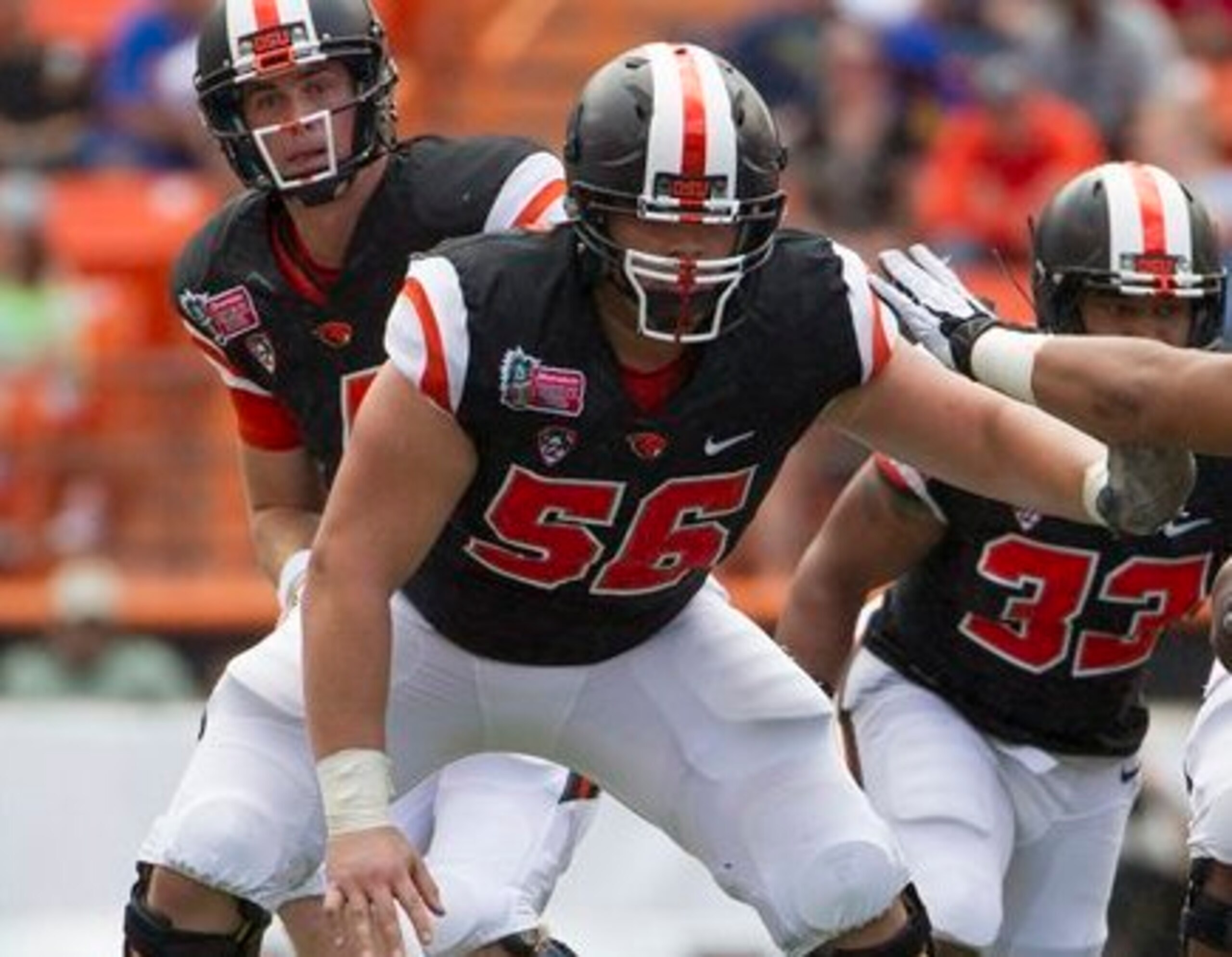 The center can snap to more than one person, but his fellow linemen aren't on that list.