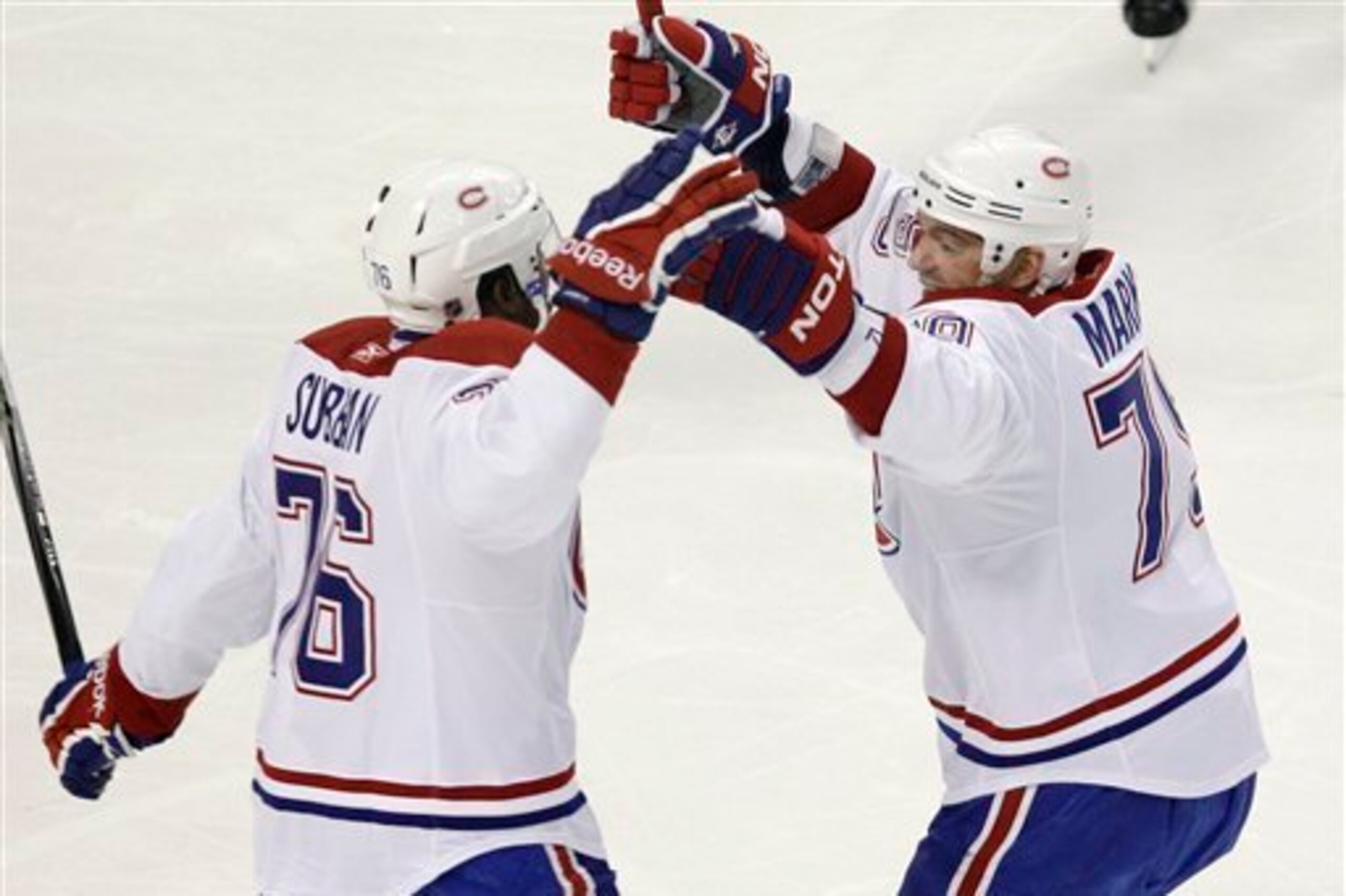 Montreal Canadiens defensemen P.K. Subban and Andrei Markov celebrate a goal. Montreal Canadiens defensemen P.K. Subban and Andrei Markov celebrate a goal.