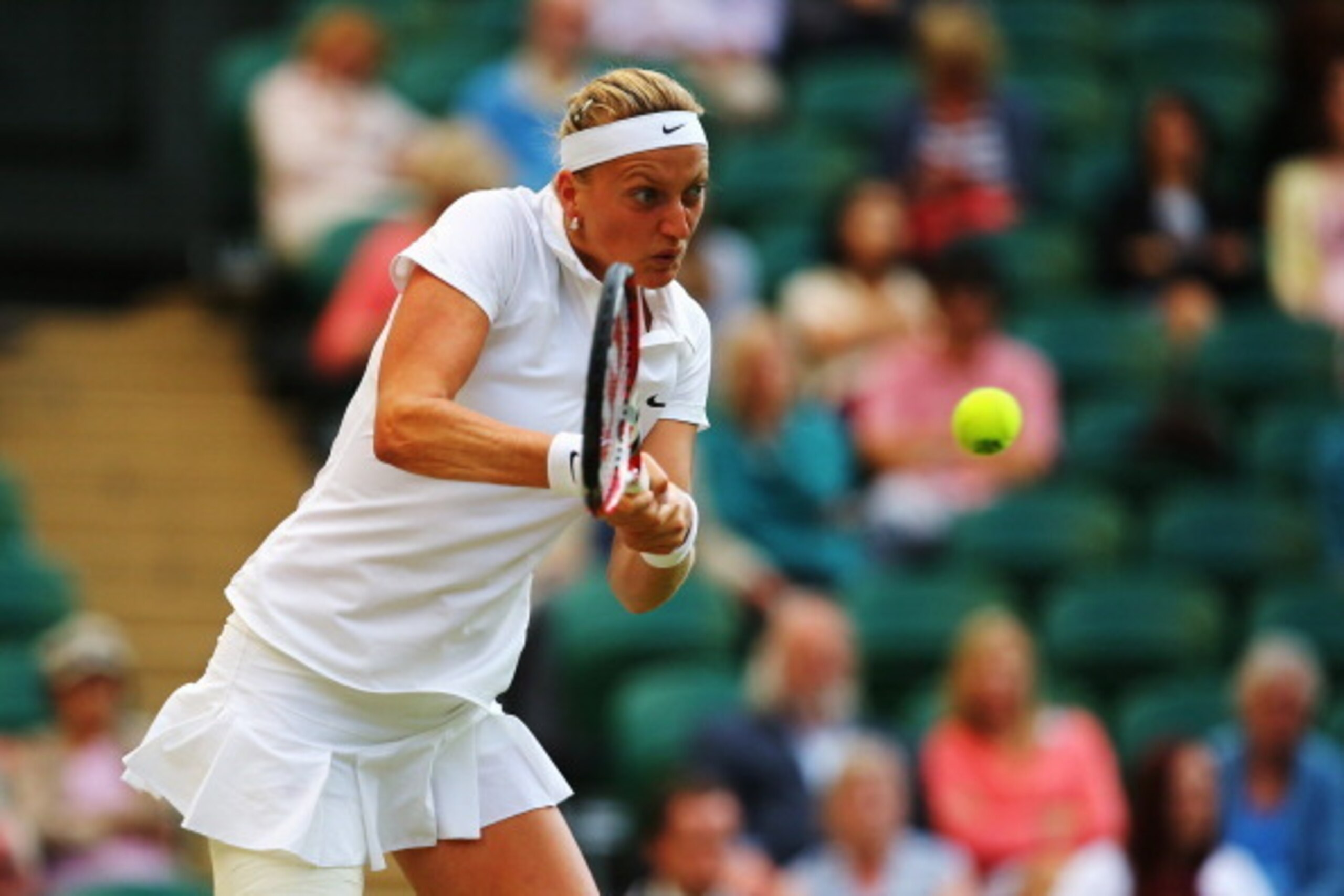 Petra Kvitova goes for a backhand during her quarterfinal match at Wimbledon. Petra Kvitova goes for a backhand during her quarterfinal match at Wimbledon.