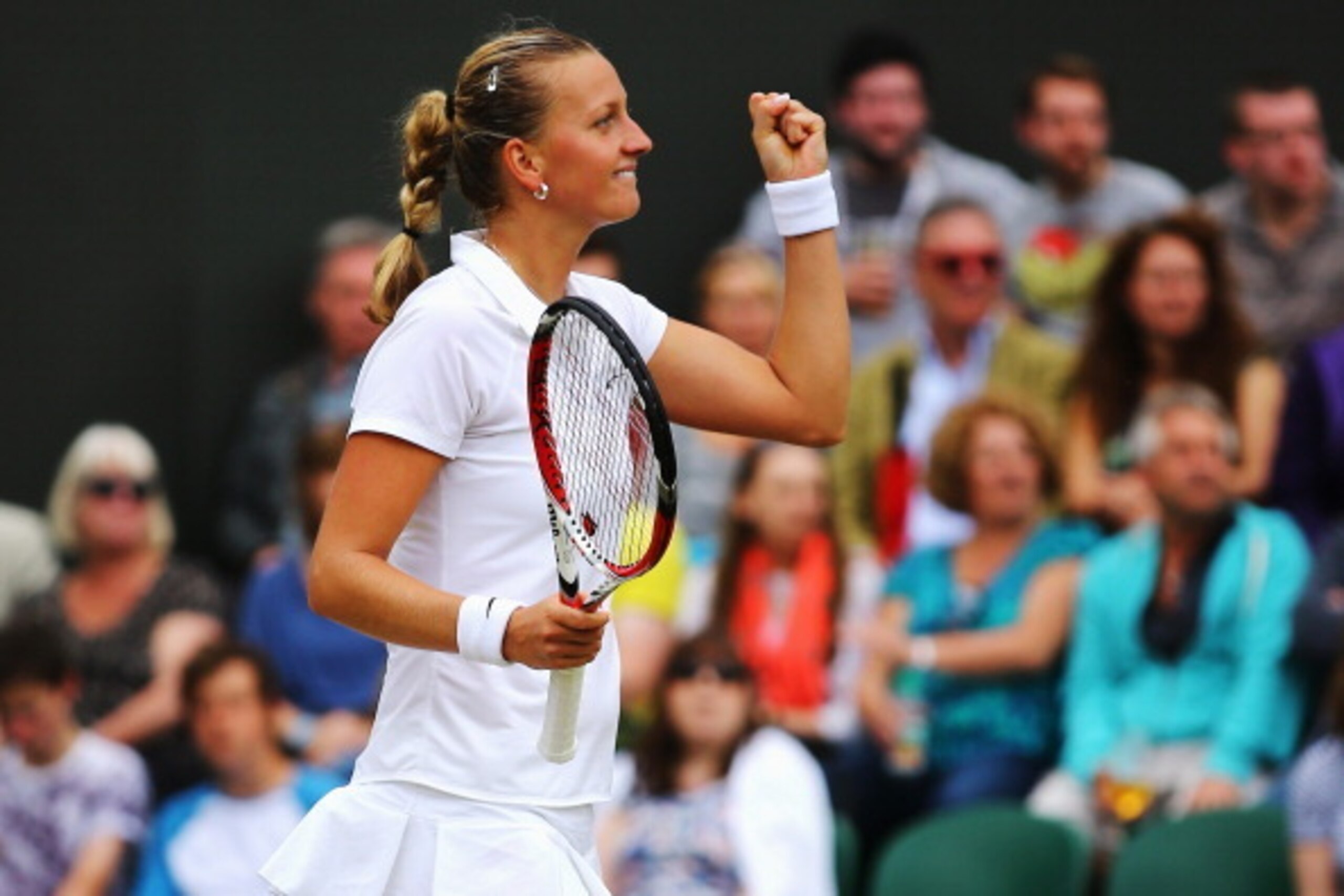 Petra Kvitova fist pumps after a third-round win at Wimbledon. Petra Kvitova fist pumps after a third-round win at Wimbledon.