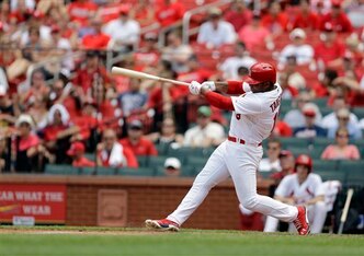 Oscar Taveras gets a hit against the Giants on June 1.