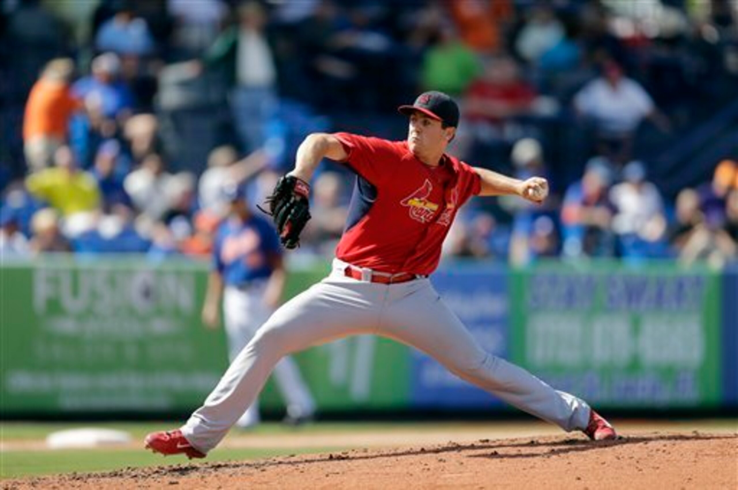 Cardinals prospect Tim Cooney throws a pitch during a Spring Training game against the Mets in 2014. Cardinals prospect Tim Cooney throws a pitch during a Spring Training game against the Mets in 2014.