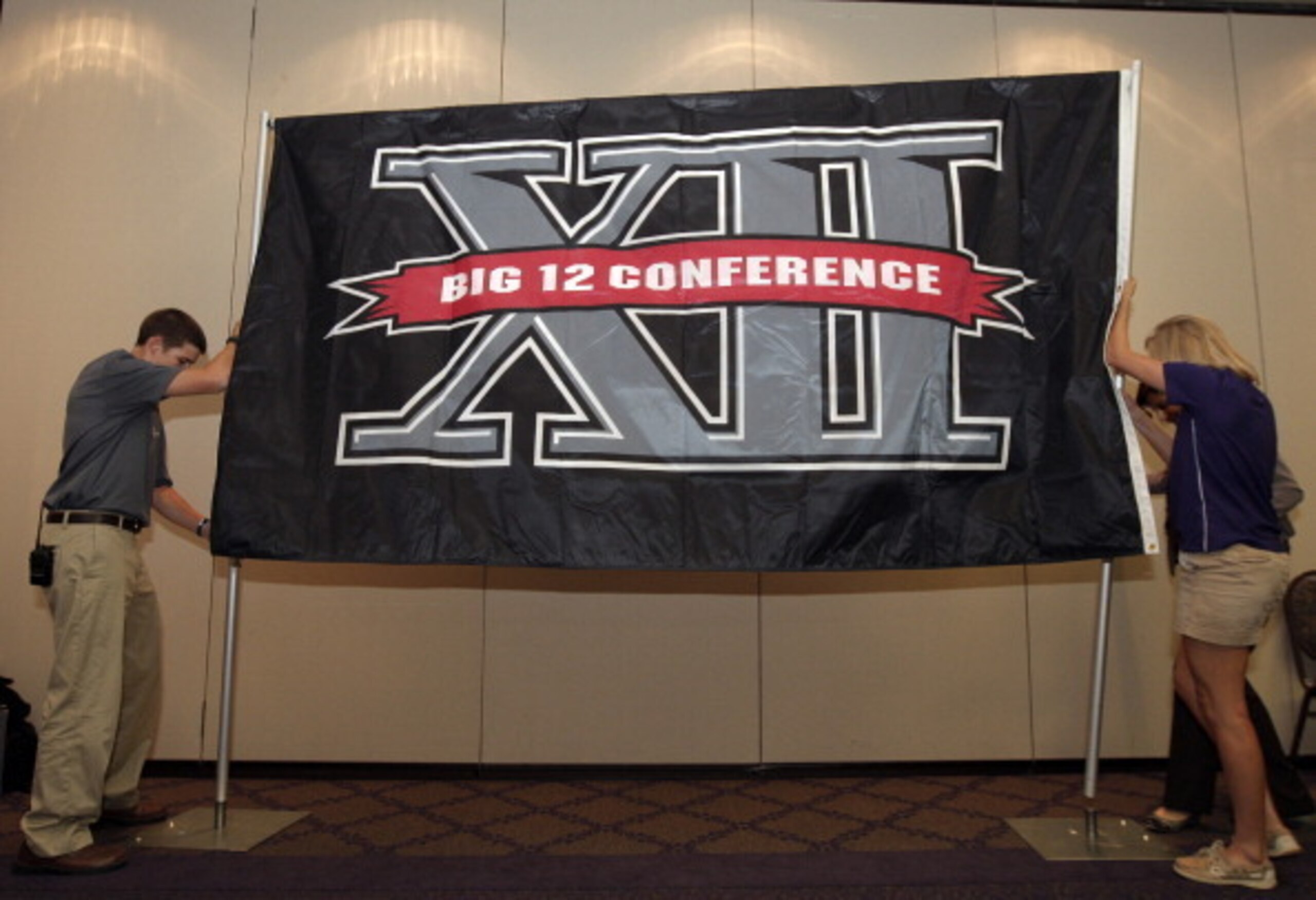 TCU erects a very portable Big 12 sign, announcing its move from the Mountain West.