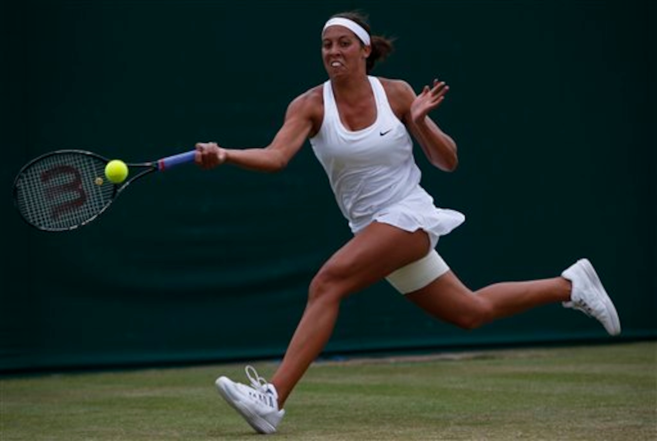 Madison Keys attempts a running forehand during her third-round match at Wimbledon.