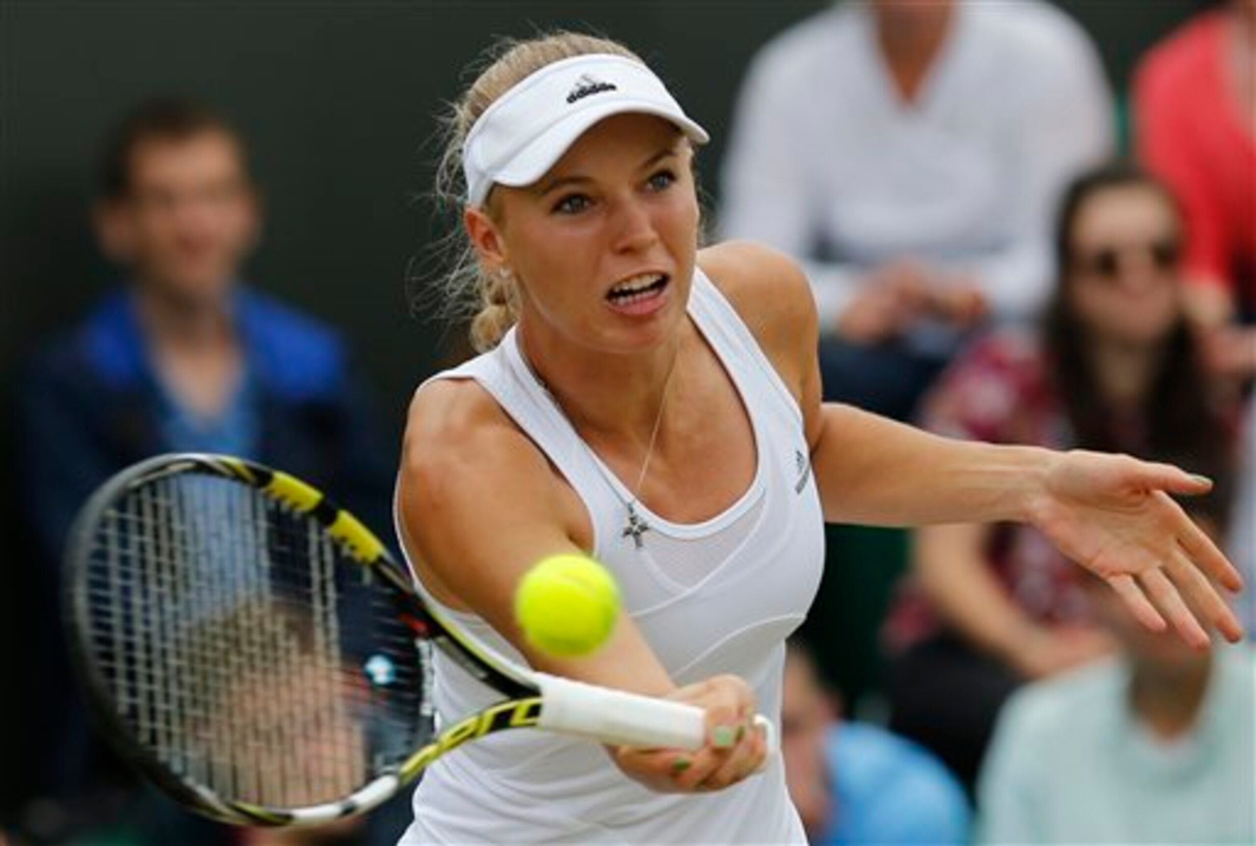 Caroline Wozniacki attempts a volley during her second-round match at Wimbledon.