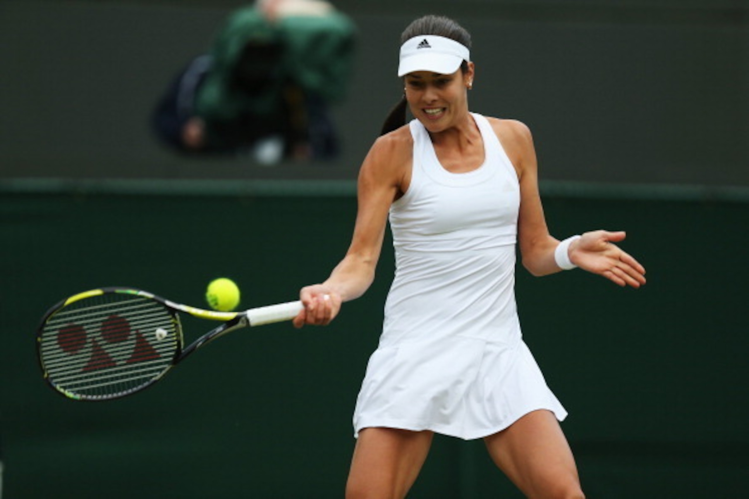 Ana Ivanovic hits a forehand during a match at Wimbledon.