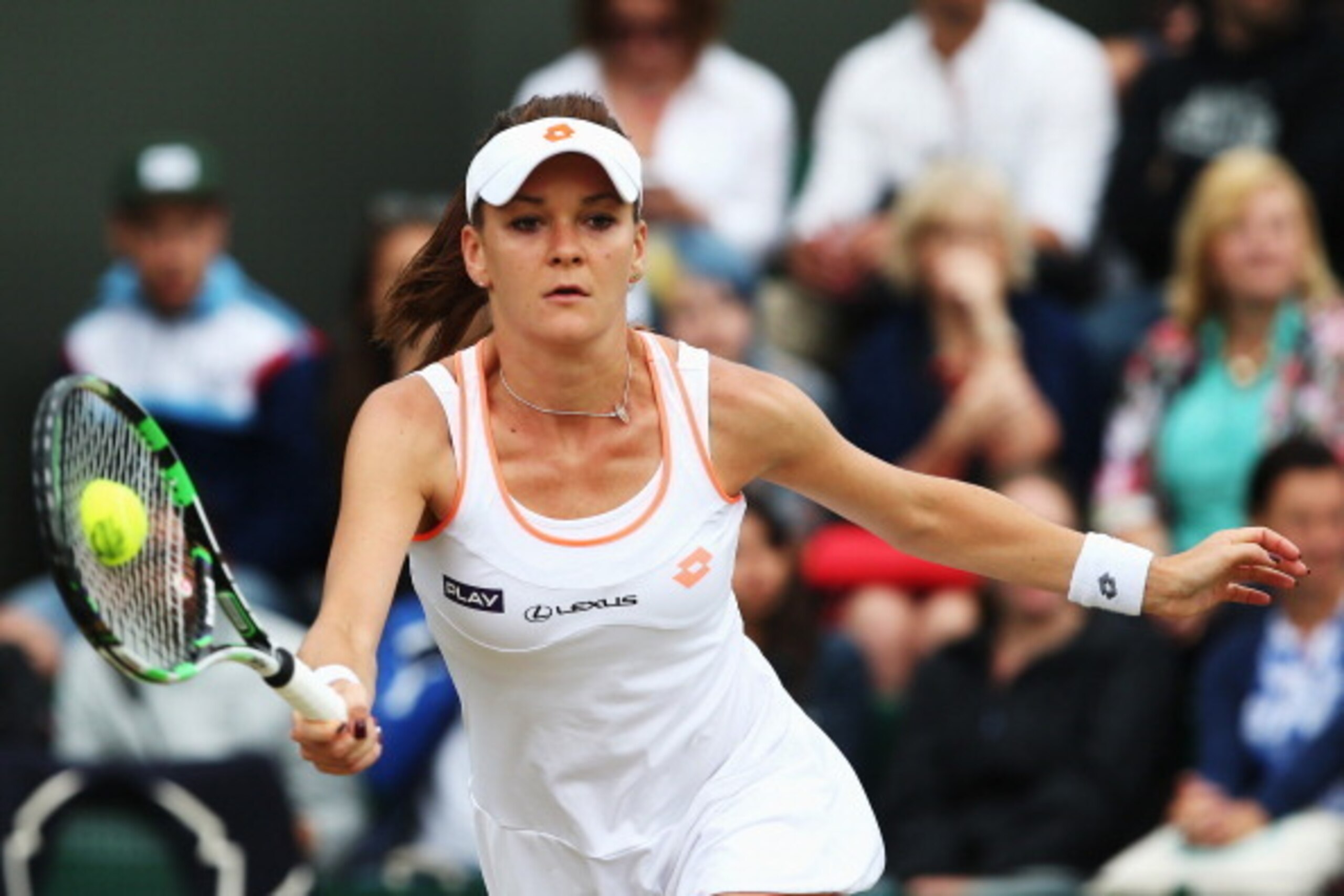 Agnieszka Radwanska hits the ball during a Wimbledon match.