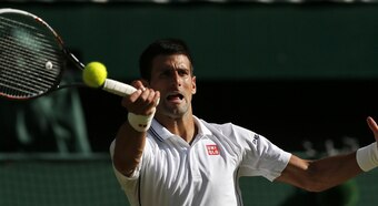 Novak Djokovic swings a forehand during the Wimbledon final.