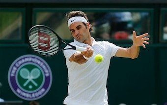 Roger Federer hits a forehand during the Wimbledon final.