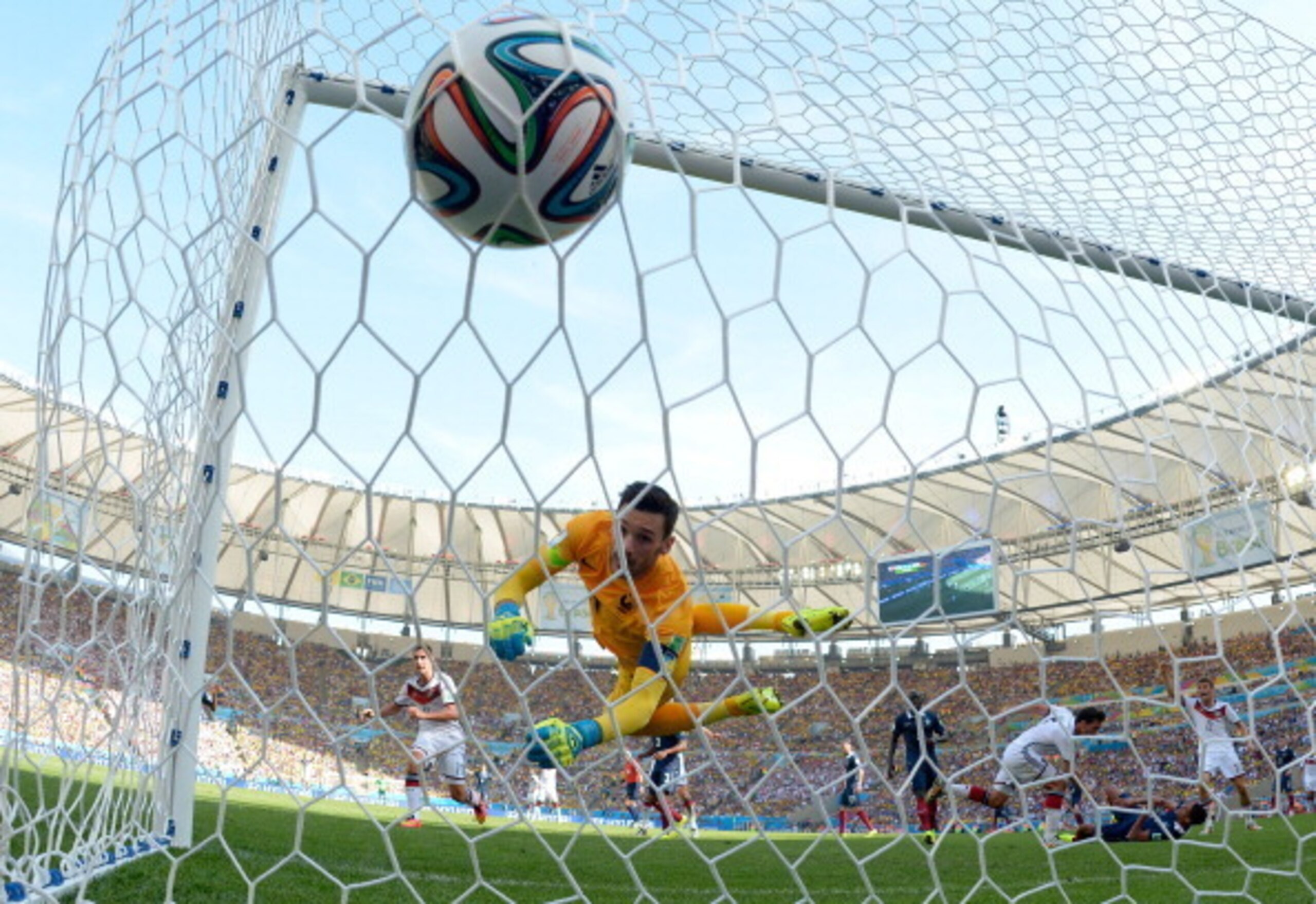 Hugo Lloris looks on in despair as Mats Hummels' header hits the back of the net.
