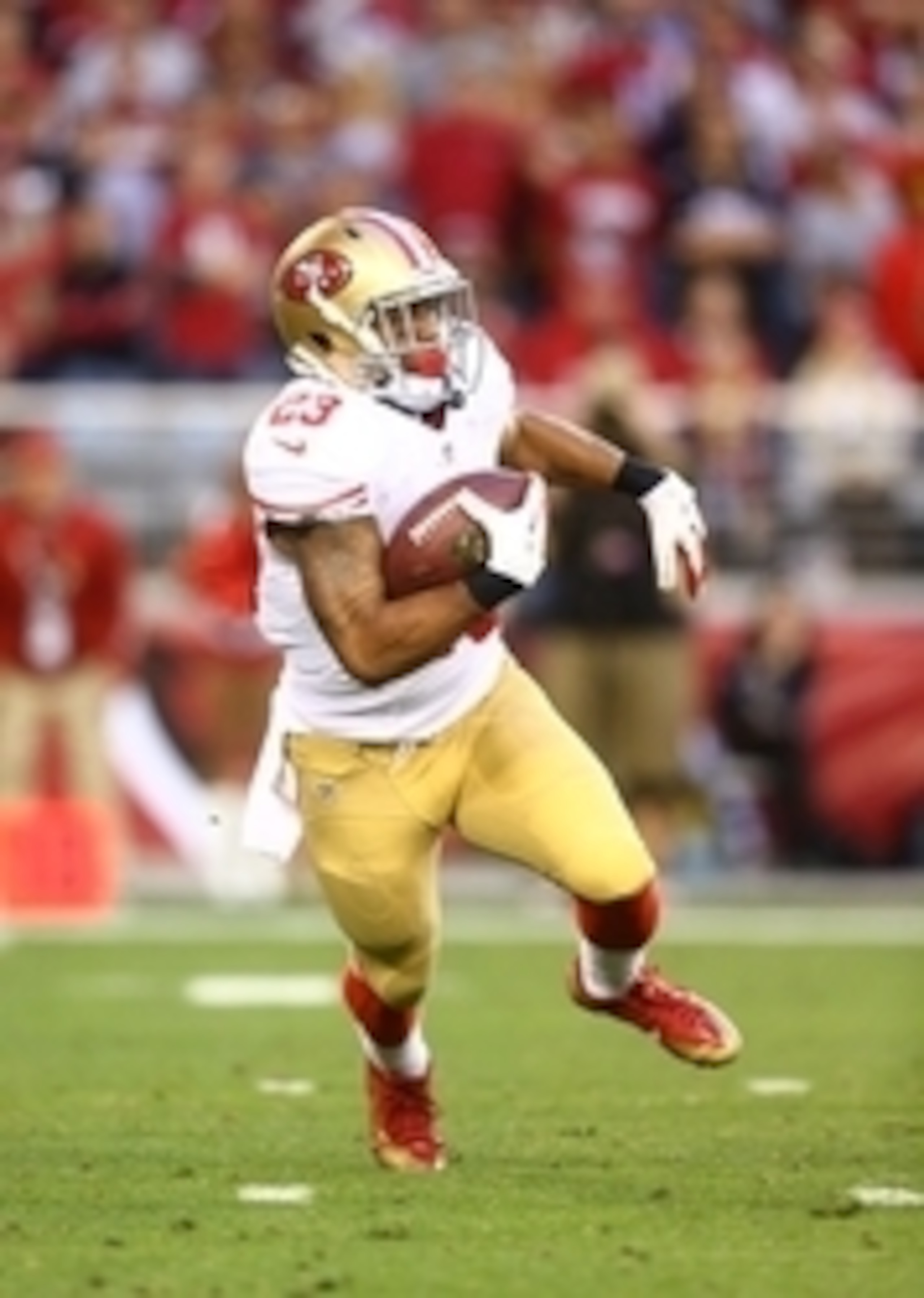 Dec 29, 2013; Phoenix, AZ, USA; San Francisco 49ers running back LaMichael James (23) against the Arizona Cardinals at University of Phoenix Stadium. Mandatory Credit: Mark J. Rebilas-USA TODAY Sports