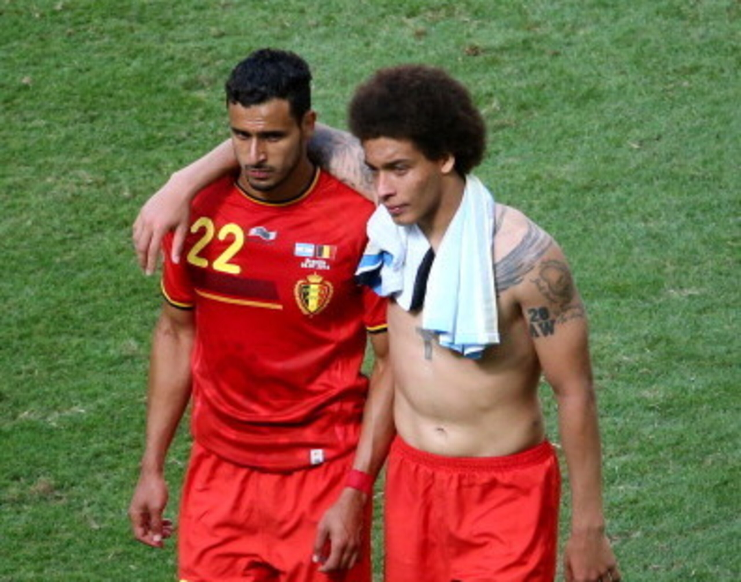Nacer Chadli and Axel Witsel commiserate together after Belgium's quarter-final exit to Argentina.