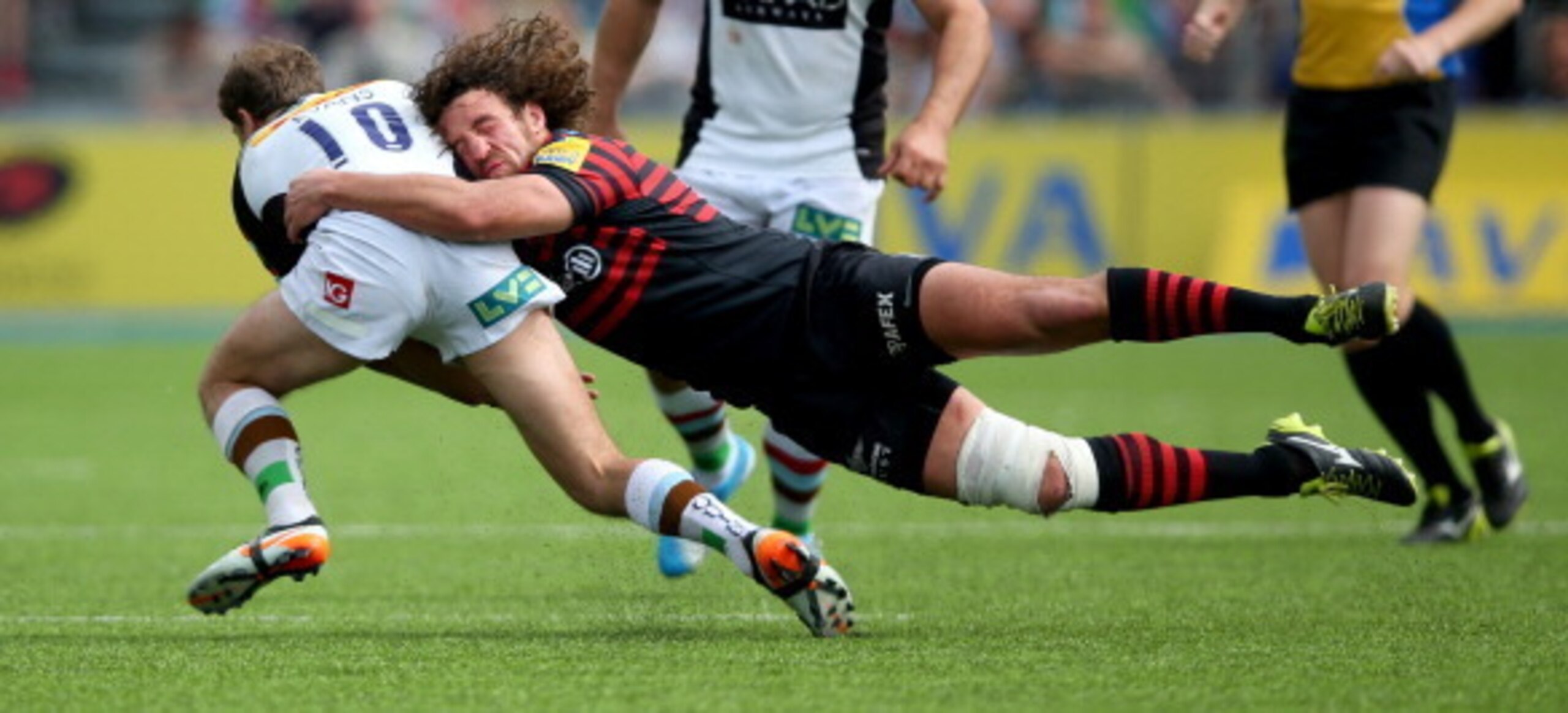 Jacques Burger tackles Harlequins' Kiwi fly-half Nick Evans in the 2014 Premiership semi-final