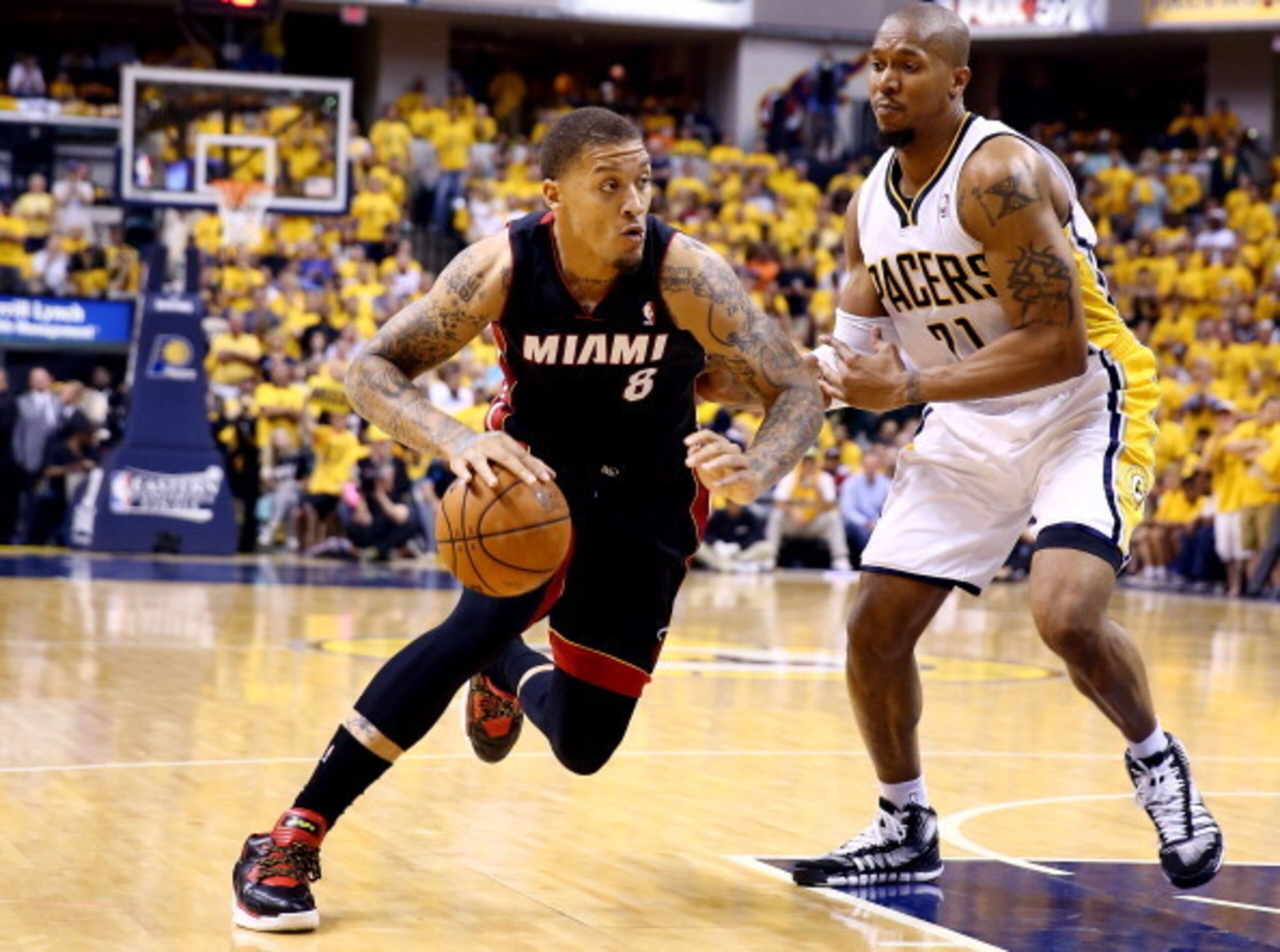 Miami Heat forward Michael Beasley drives against Indiana Pacers forward David West. Miami Heat forward Michael Beasley drives against Indiana Pacers forward David West.