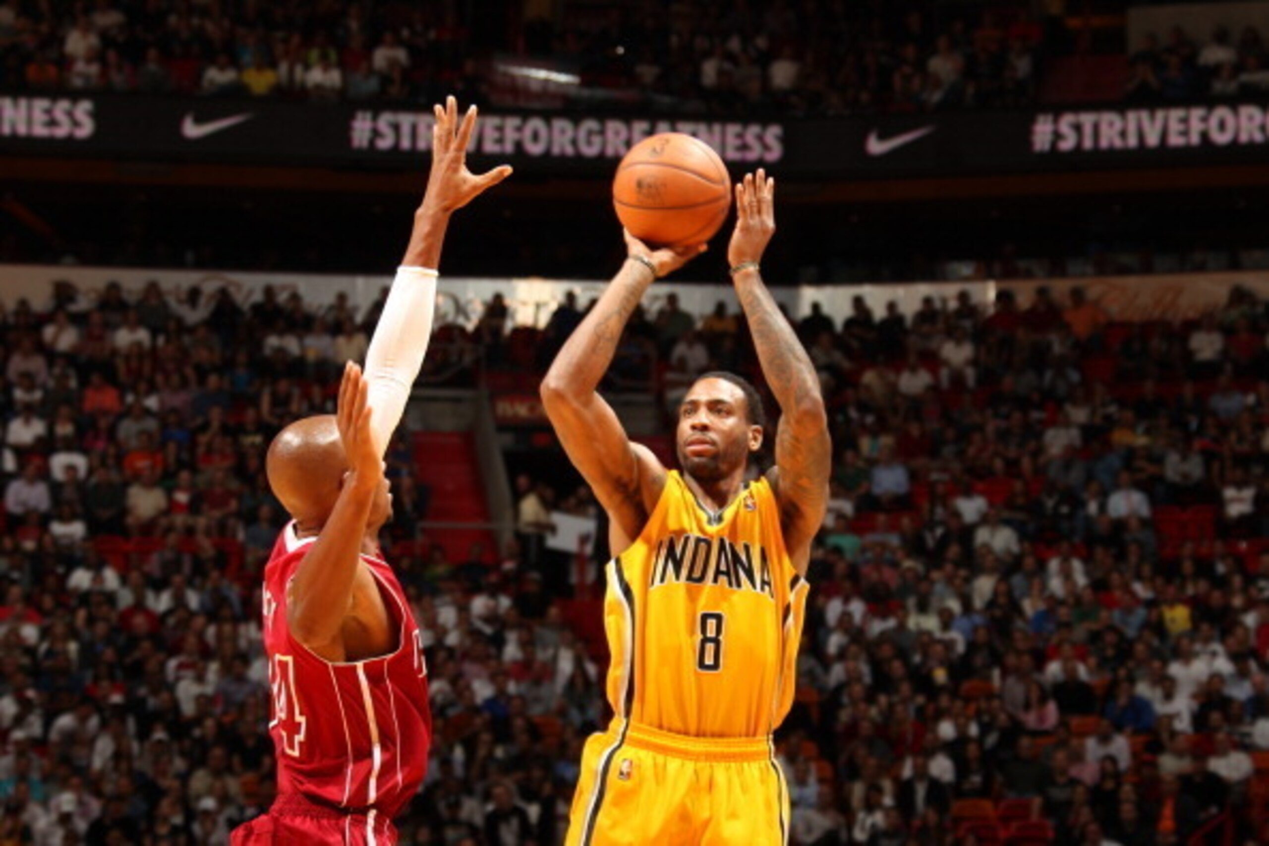 Indiana Pacers guard Rasual Butler shoots over Miami Heat guard Ray Allen. Indiana Pacers guard Rasual Butler shoots over Miami Heat guard Ray Allen.