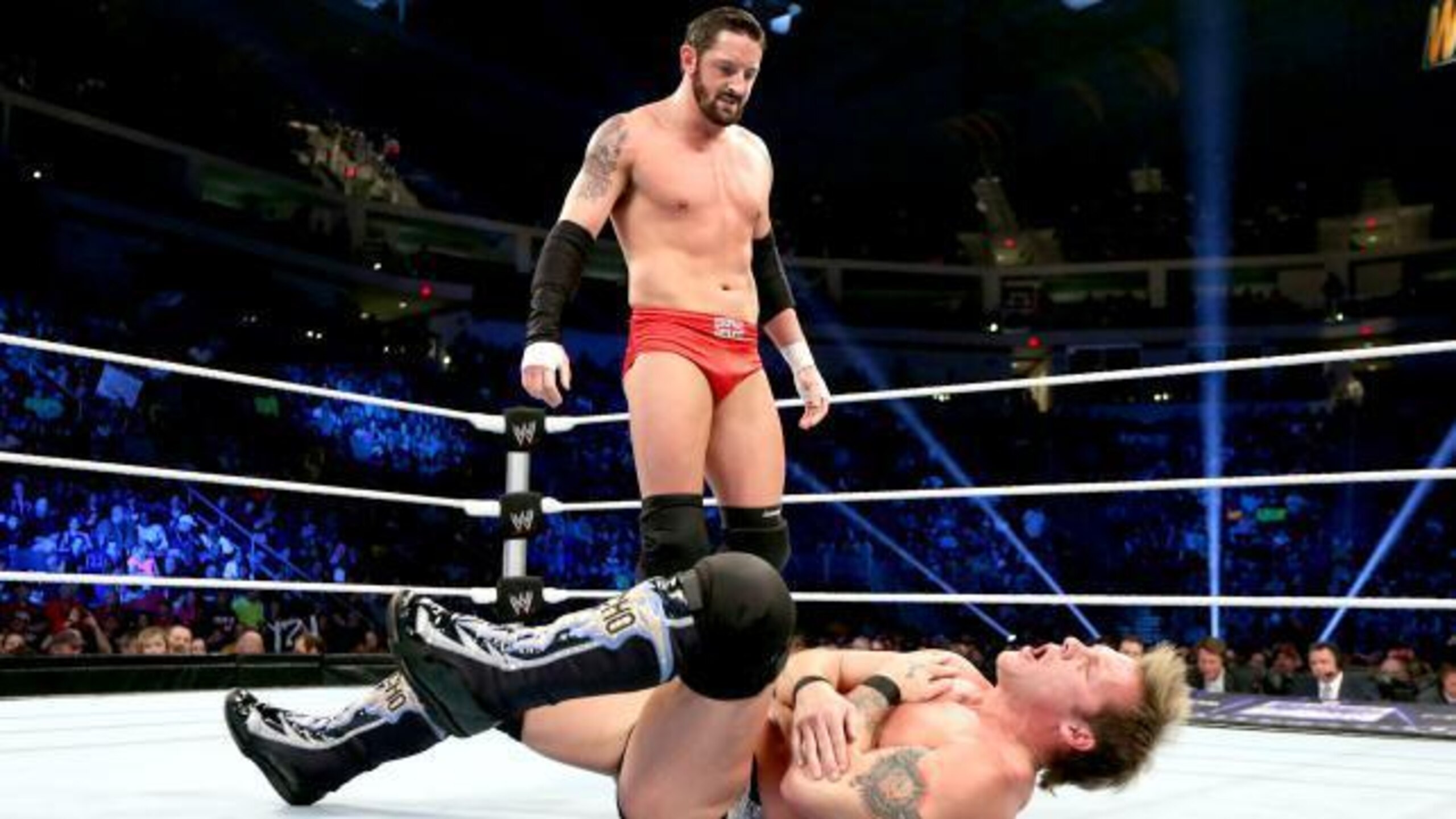 Bad News Barrett lays out Chris Jericho.