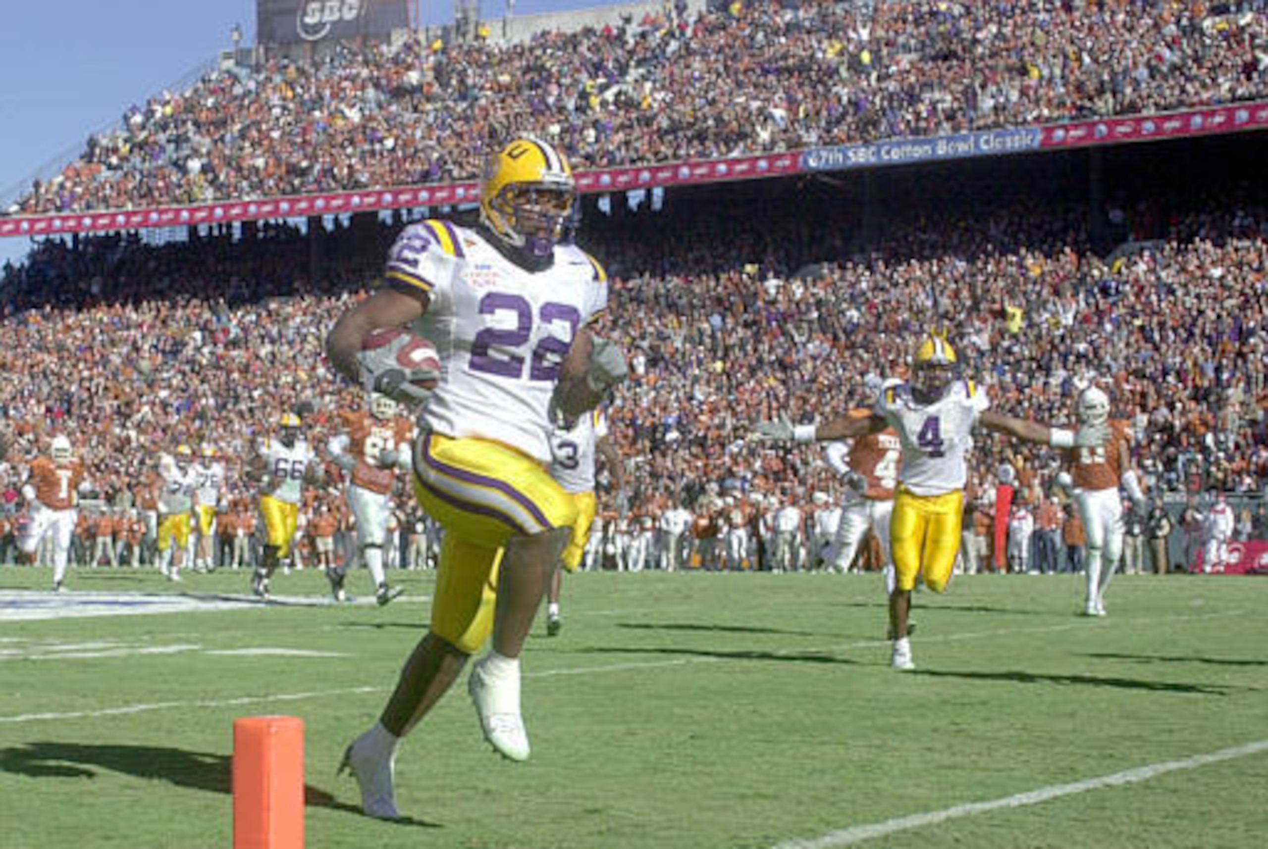Louisiana State's running back LaBrandon Toefield (22) runs into the end zone on a 20-yard pass for touchdown against Texas in the first quarter at the Cotton Bowl in Dallas, Wednesday, Jan. 1, 2003. (AP Photo/L.M. Otero)