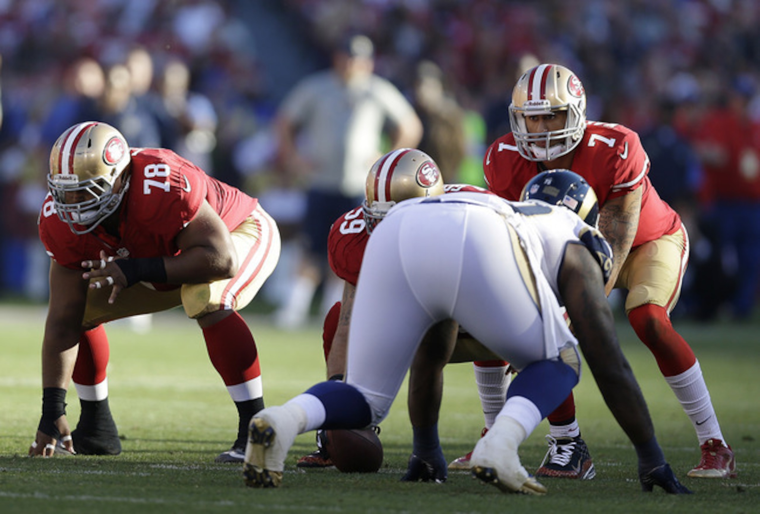 Looney at guard against the St. Louis Rams