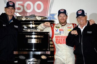 DAYTONA BEACH, FL - FEBRUARY 23:  (L-R) Crew chief Steve Letarte, Dale Earnhardt Jr., driver of the #88 National Guard Chevrolet, and team owner Rick Hendrick celebrates in victory lane after winning the NASCAR Sprint Cup Series Daytona 500 at Daytona Int