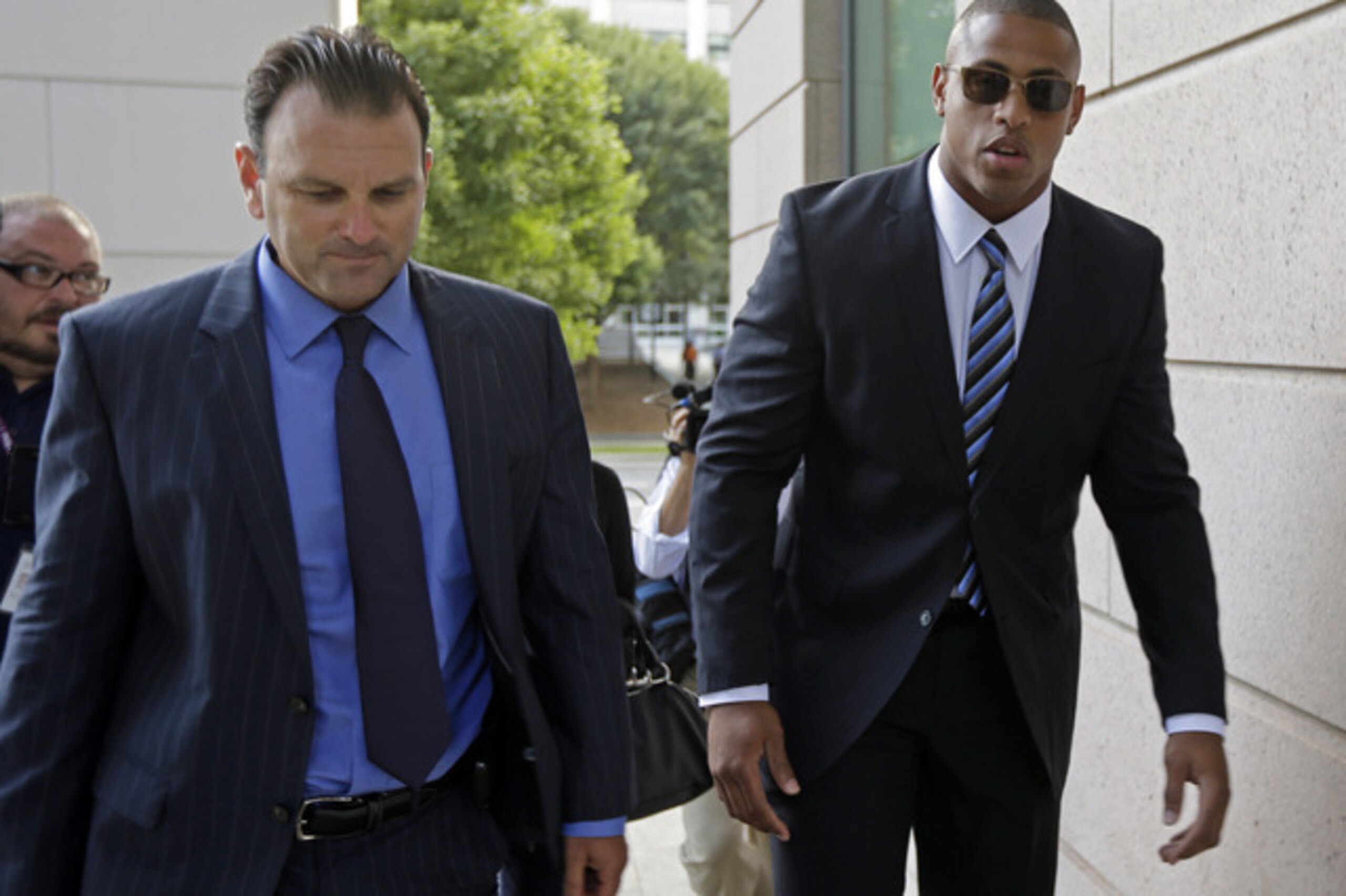 Greg Hardy (right) and agent Drew Rosenhaus (left)