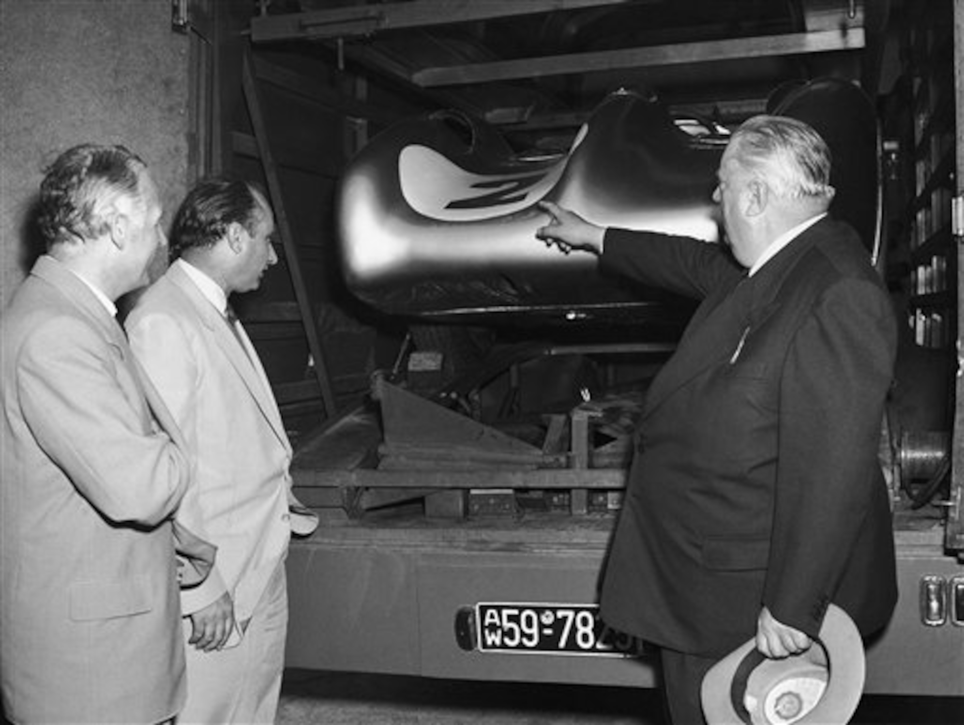 Kling with his Mercedes teammate, Juan Manuel Fangio, and team manager Alfred Neubauer. Kling with his Mercedes teammate, Juan Manuel Fangio, and team manager Alfred Neubauer.