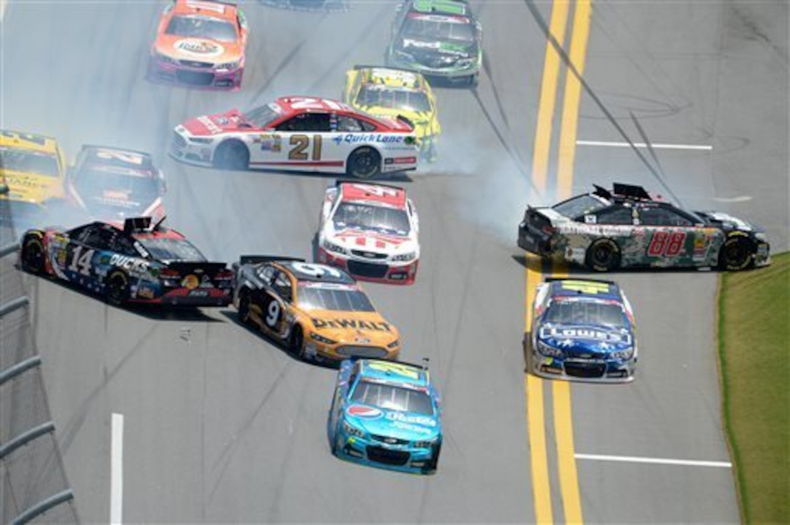The Stewart-Haas Racing cars have all too often been caught up in messes such as this in 2014.