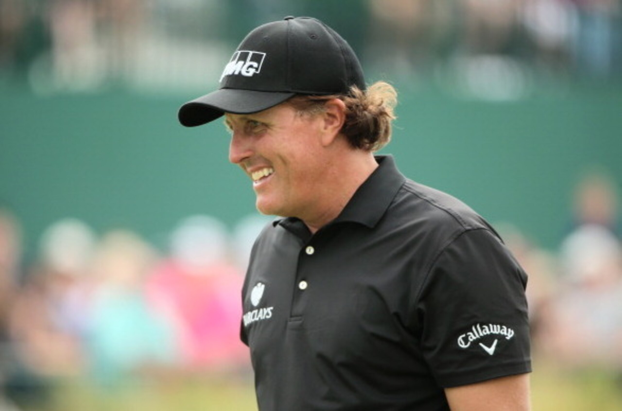 HOYLAKE, ENGLAND - JULY 20:  Phil Mickelson of the United States smiles on the 18th green during the final round of The 143rd Open Championship at Royal Liverpool on July 20, 2014 in Hoylake, England.  (Photo by Andrew Redington/Getty Images)