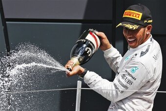 Hamilton celebrates at Silverstone.